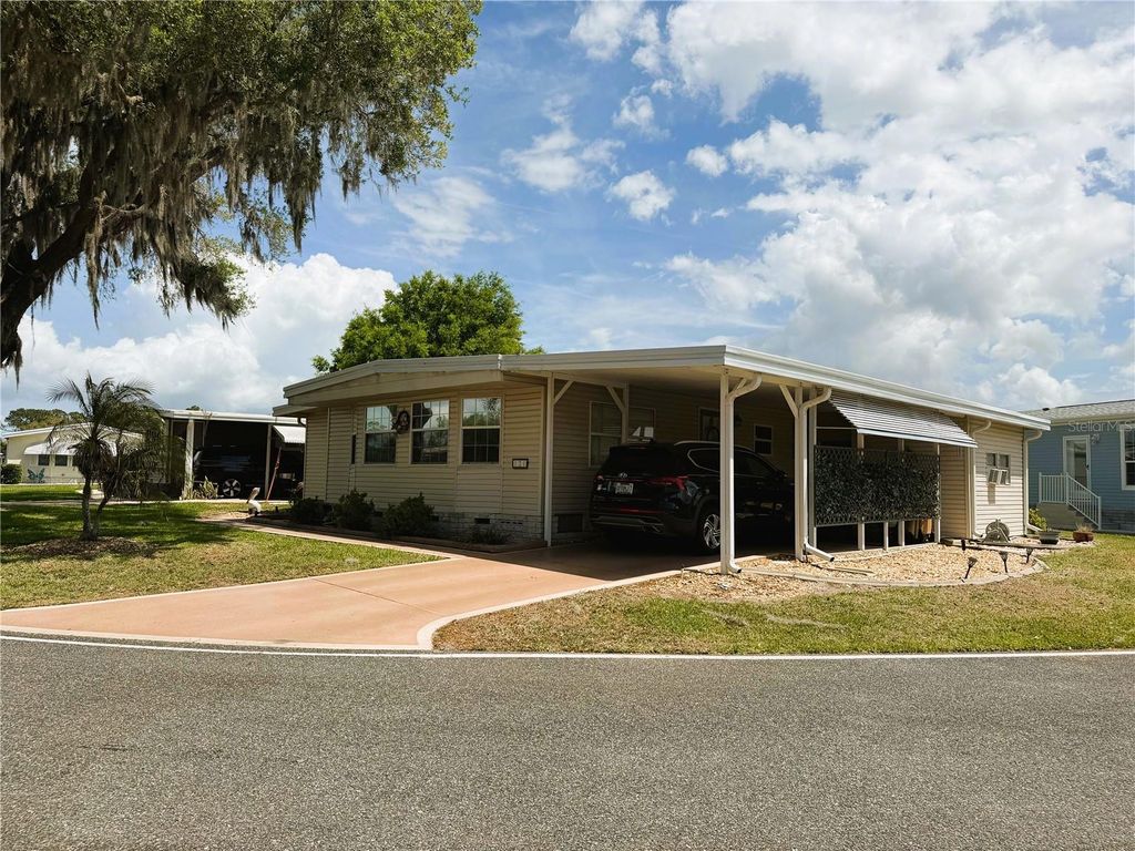 Photo of 121 Azalea Trail, Leesburg, FL 34748 (MLS # R4910982)