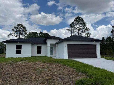 Photo of 765 Puccini Ave S, Lehigh Acres, FL 33974 (MLS # S5149392)