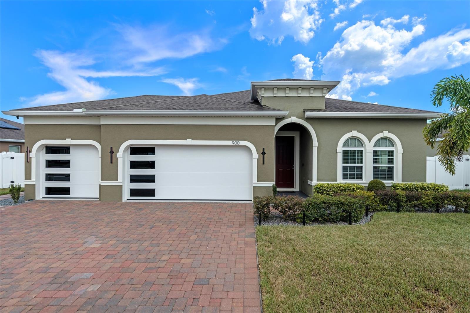 Welcome to this beautifully upgraded 4-bedroom, 2-bathroom home featuring a spacious open floor plan and a thoughtfully designed split layout for added privacy. From the moment you walk in, you'll notice high-end finishes throughout—including premium glazed porcelain tile, smart WiFi lighting, and luxurious touches in every room.
The large kitchen is a true centerpiece, boasting a double waterfall-edge island, top-of-the-line appliances, and a smart refrigerator—perfect for cooking, entertaining, or everyday living. The upgraded master suite includes a custom walk-in closet, while each additional bedroom is generously sized.
Enjoy peace of mind with a full suite of smart home and safety features, including a whole-house surge protector, individual appliance surge protection, a smart thermostat, smart light switches, exterior surveillance system, home security system, and a generator hookup - perfect for hurricane season. The 3-car garage features the only upgraded garage door of its kind in the neighborhood, adding curb appeal and distinction. In addition, the house features a whole-home water softener!
The covered lanai overlooks a well-maintained backyard with a large concrete pad—already poured and ready for a hot tub, outdoor kitchen, or storage shed. Whether you're looking to relax or expand your outdoor living space, this home offers flexibility and room to grow.
All of this, just minutes from local schools, shopping, parks, and major highways—move-in ready and waiting for you.