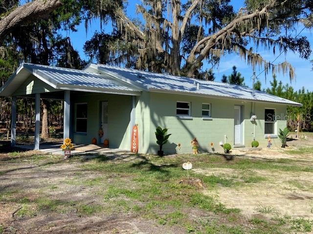 Photo of 129 SE 122nd Avenue, Old Town, FL 32680 (MLS # O6450139)