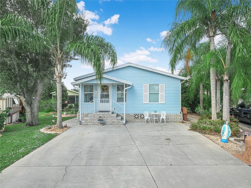 Fully furnished and turnkey, this 2/2 Palm Harbor manufactured home is move-in ready and just waiting for it's new owner.  Located in the pet friendly 55+ gated community of Saddlebag Lake Resort, where you OWN the land, it's the perfect place to live year-round or come to for a winter getaway.  With great curb appeal, the front is flanked by royal palm trees, a welcoming sight!  The home is surrounded by nice landscaping and walkways, plus a secluded patio on the side and a shed at the back of the property. Walk through the front door and you'll find yourself in a very comfortable living room with adjoining dining area.  The kitchen is the focal point of this home, with it's solid wood cabinets, a generous amount of counter space with a place for pulling up a chair to work on your computer, and a coffee bar. The owners suite is large enough for a king size bed, has an abundance of closet space and a large ensuite bathroom. Your guests will have a great place to retreat to, with their own bedroom and separate bathroom.  The full width family room at the back of the home functions as a multipurpose space and is outfitted as a cozy breakfast nook and entertainment place, with it's large storage cabinets for games or craft supplies.  When you can pull yourself away from the home, check out the resort with it's myriad of amenities, including a sparkling community pool, hot tub, tennis and pickle ball courts, professional grade shuffleboard courts, a rec room with saunas and pool tables, a fitness center, not to mention a boat ramp so you can go fishing in Saddlebag Lake!  There's even a lakeside beach house with a covered patio and inside kitchen that you can use at no cost for private parties, just reserve it.  Your furry family members will enjoy the dog park at the back of the resort, complete with a dog washing station.  Improve your golf game at the driving range, join a club, or get to know your neighbors at the clubhouse!  The low quarterly HOA dues include use of all the amenities, as well as your water, sewer and trash pick-up.  There's truly something for everyone here. Isn't it time you came home to Saddlebag Lake Resort?  Call now for your private tour before this gem is gone!