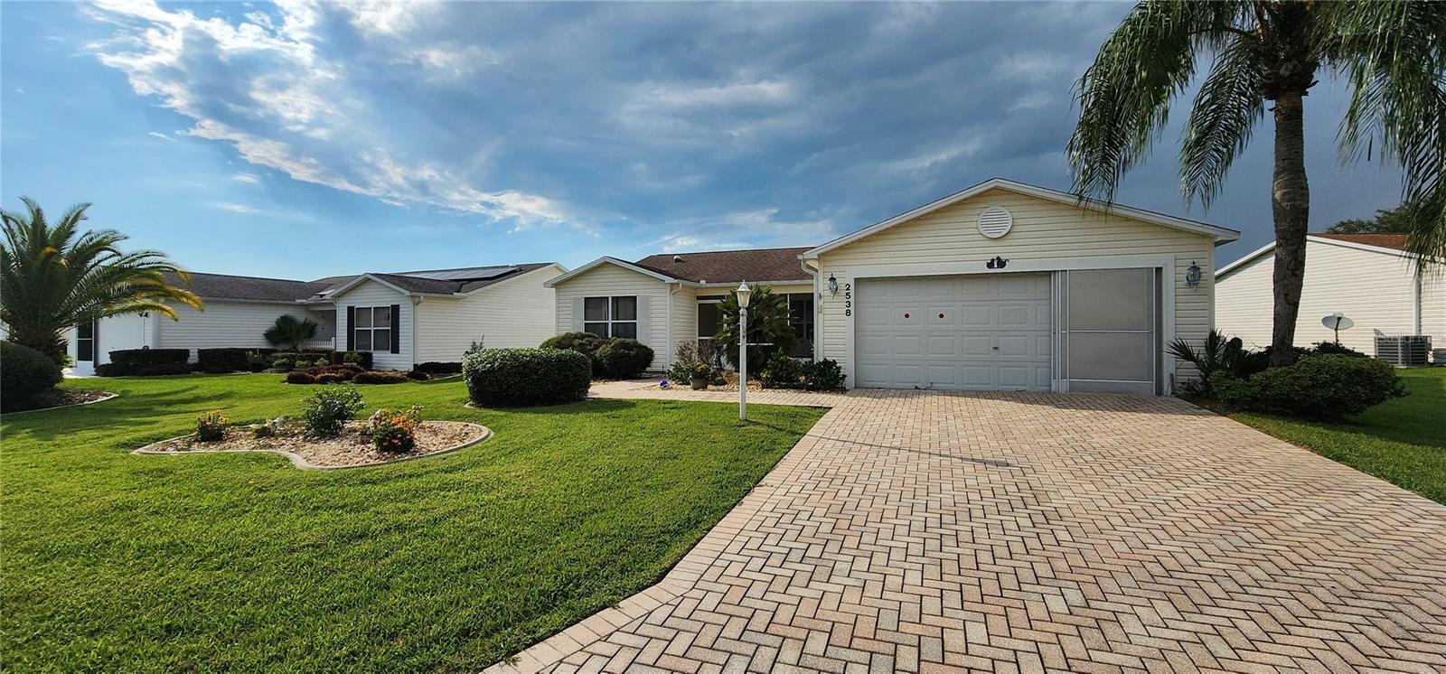 MOTIVATED SELLER – BRING YOUR OFFER TODAY!
Step into the lifestyle you’ve been dreaming of with this beautifully appointed Florida home in The Villages.
From the moment you arrive, the brick driveway, walkway, and charming screened front porch create an inviting first impression. Inside, the leaded-glass entry door opens to a bright, open layout with vaulted ceilings, warm laminate flooring, and abundant natural light.
The split-bedroom floor plan ensures comfort and privacy, with three spacious bedrooms. The primary suite offers crown molding, dual walk-in closets, and a spa-inspired bath with granite countertops, dual vanities, a walk-in shower, and private water closet.
Multiple living spaces allow you to enjoy Florida your way—whether it’s the heated and cooled Florida room, the enclosed lanai, or the screened patio perfect for entertaining.
With an oversized garage that accommodates two cars plus a workshop, and a floored attic for easy storage, practicality meets style.
All of this is just minutes from pools, golf courses, shopping, and the vibrant Savannah Center and town squares. And all a leisurely golf cart ride away.
This home combines comfort, elegance, and convenience—don’t miss the chance to make it yours.
ROOF 2017 | AC 2019