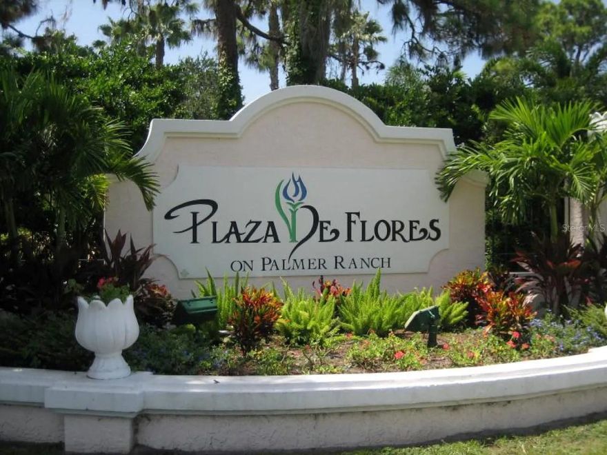 Welcome to fully renovated corner-unit condo in a highly sought-after Plaza De Flores gated community. Rarely available, beautiful, light, and spacious 3 BR 2 BA corner end unit. Designed for comfort and convenience, this residence offers many features, including impact windows and sliders and an expansive private lanai, perfect for relaxing or entertaining. Completely updated kitchen showcases high-end stainless-steel appliances, a built-in oven and microwave, and ample cabinetry for storage. Both bathrooms were tastefully renovated with tiled walk-in showers and high-end fixtures, adding a modern, spa-like touch. This open concept unit offers easy to care counters, newer front loader washer and dryer, newly HVAC with transferable 10-year parts and labor warranty (2022) and new installed natural wood floors (2025). The unit has a new roof (2023), offering peace of mind for years to come. The condo fee covers cable, water, sewer, and trash, making ownership both easy and economical. Additional highlights include a new covered carport (2025) and paving (2025) and a truly prime unit location, just steps from the clubhouse, resort-style pool, fitness center, and tennis courts.   Ideally situated in Palmer Ranch, you’re just minutes to Siesta Key Beach, downtown Sarasota, marinas, The Legacy Trail, and enjoy shopping and dining right outside your door. This is Florida living at its best..... move-in ready and perfectly located.