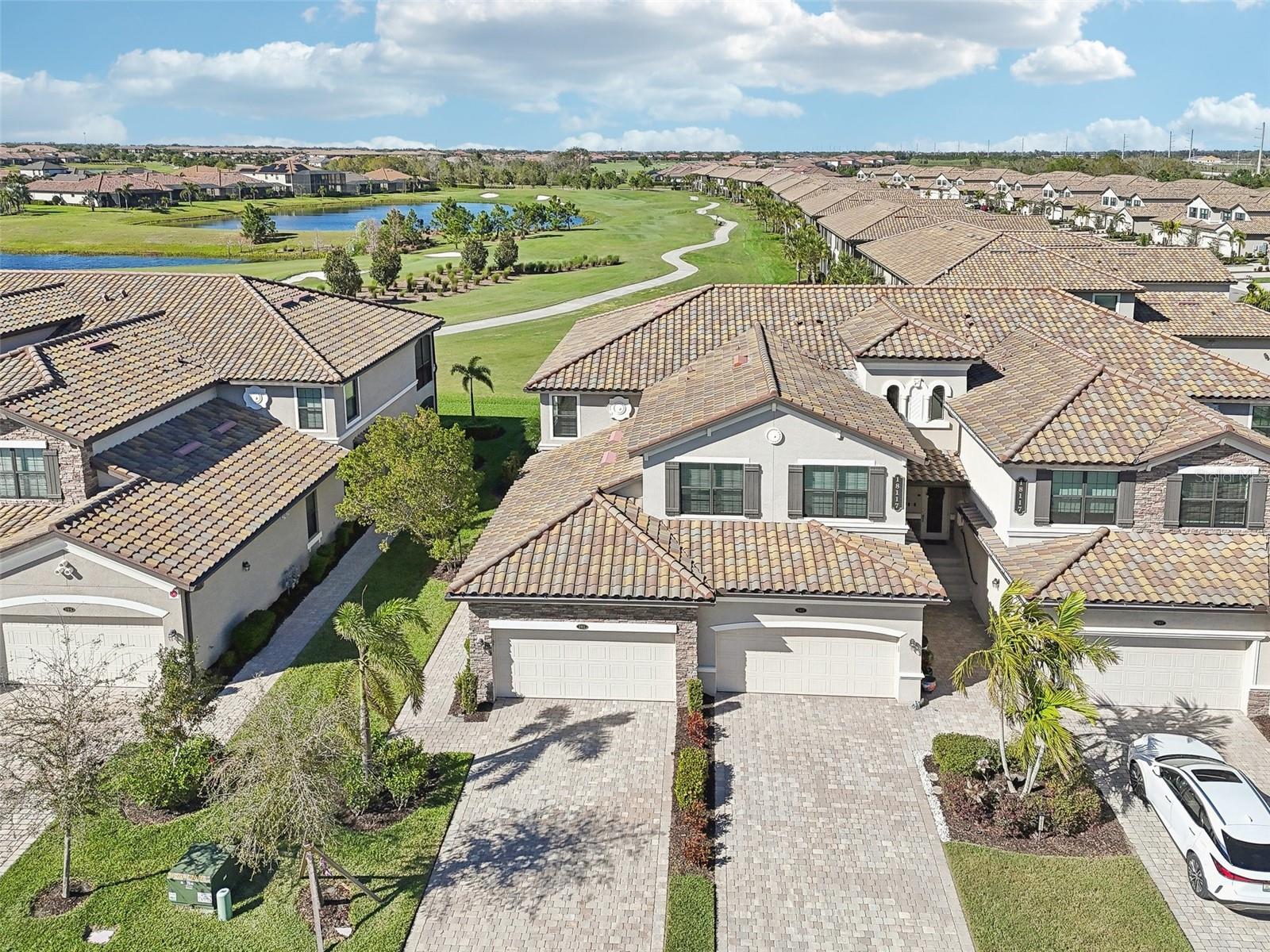 Ideally Positioned for Golfside Living – PRIME Corner Location with Stunning Golf Views. Discover Luxury Resort-Style living in Lakewood National Golf Club with this lower-level 3-bedroom, 2-bathroom coach home which sits on a prime corner overlooking Piper 11 & 12, offering breathtaking golf course views, set back for privacy. Unwind with sunset and water views from your lanai or take in the sunrise from the satellite pool across the street.
The open-concept split-bedroom floor plan boasts exceptional upgrades and a bright, inviting atmosphere with fresh interior paint. The gourmet kitchen features a large granite center island, newer refrigerator (2024), and stainless steel appliances. Kitchen upgrades include a touch-free faucet, spacious single-bowl sink, gas slide-in range oven with air fryer and convection, tile backsplash, roll-out cabinet shelving and under-cabinet lighting. A sleek stainless steel hood replaces the microwave, enhancing both style and ventilation. Custom built-ins in the dining and family rooms are topped with quartz counters. The primary suite includes dual walk-in closets, an en suite bath with dual vanities and an easy-to-clean shower with coated glass, and lanai access through glass sliders. A laundry room with built-in cabinetry and extra shelving adds convenience.
The garage includes an epoxy-coated floor, pull-down attic stairs with plywood flooring for storage, a special generator plug, and plenty of wall-mounted racks for organization. The lanai features a weather-resistant epoxy coating, perfect for enjoying Florida’s sunshine with seamless access from glass sliders. The home also offers impact-rated windows and sliding doors for security and efficiency.
Lakewood National Golf Club provides world-class amenities within this guard-gated community with 24-hour security, including a beach-entry lagoon pool, Tiki bar, spa, fitness center, tennis, pickleball, bocce, and practice facilities. The Grand Clubhouse offers fine dining, a bar, and a vibrant social calendar. The community also has miles of scenic walking trails and recreational spaces. As a resident, you'll enjoy membership to the 36-hole Arnold Palmer-designed golf course.
Located in Lakewood Ranch, one of the nation’s top master-planned communities, you'll have access to trails, parks, lakes, year-round events, shopping, dining, healthcare, and top-rated schools—all just minutes away.
Don’t miss this rare opportunity—schedule your private tour today!