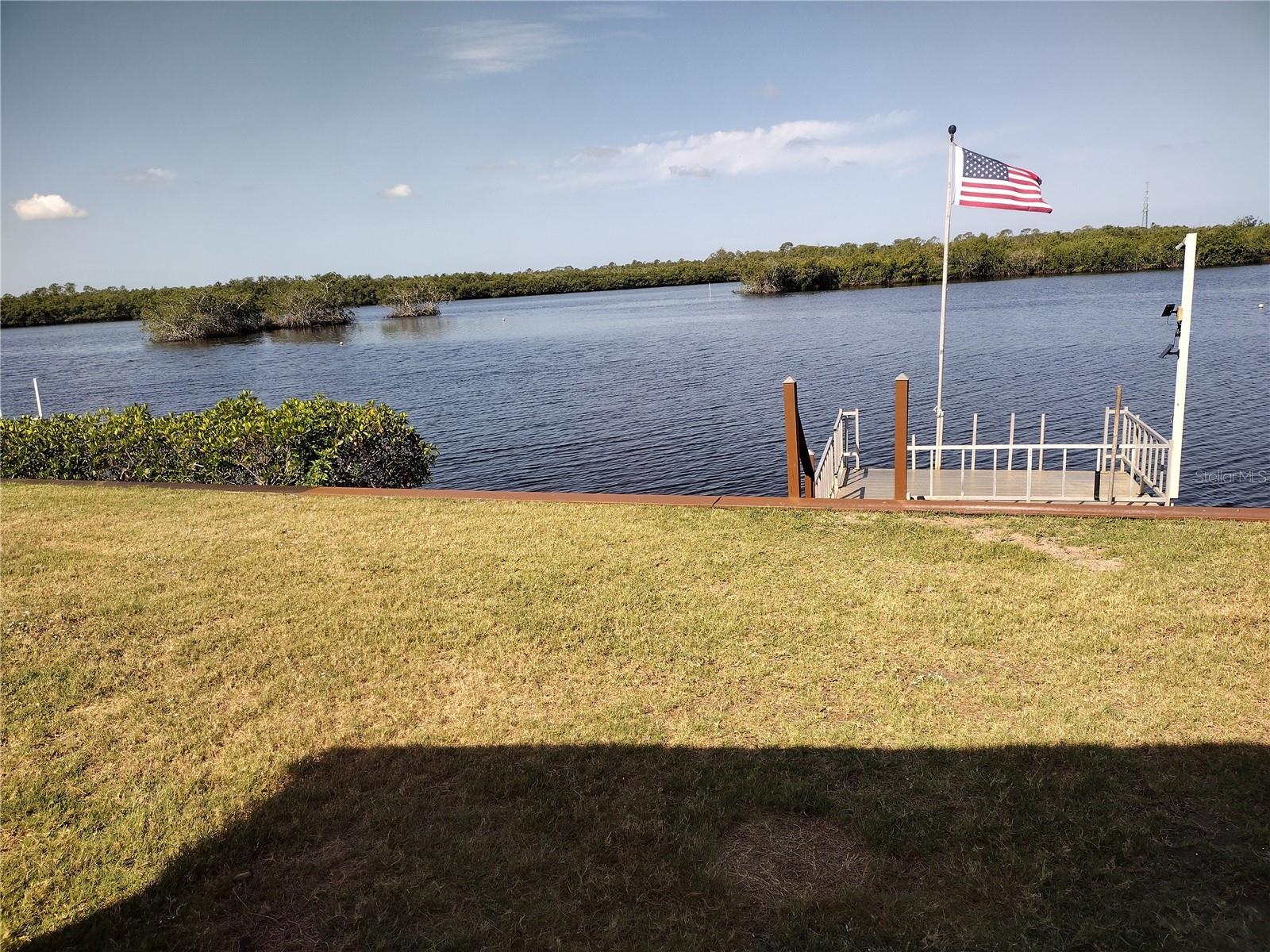 Waterfront property located on the Myakka River in the premier community of Lazy River Village. About 1500 sq ft manufactured home with spectacular sunset views. It includes two bedrooms, two baths, living room, dining area. Updated kitchen with with view of the river from the kitchen. Walk in closets with ceiling fans in all rooms. Private boat dock. Enjoy resort living with many activities and clubs. Fully equipped wood shop, along with a community pool, tennis and pickleball courts, workout center and other amenities. HOA dues include internet and cable TV, weekly garbage pickup, lawn cutting, upkeep of all amenities, pool, hot tub, fitness room, clubhouse, etc. This home is part of Lazy River Village, a 55 and over active community. Tons of activities to keep you busy. Never boring if that's your choice. The water view is very calming from your Lazy boy chair in the Living room.