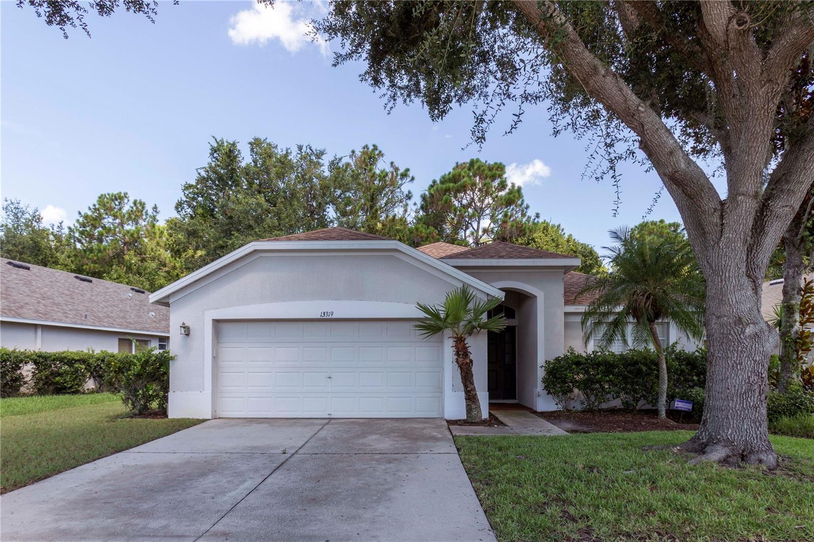 Welcome to your Florida Dream home located in a gated community. This spacious block home built 2005 has 4 bedrooms, 2 baths, 2 car garage, a new roof and AC. Conveniently located close to the Suncoast Parkway. The neighborhood features beautiful mature trees and landscaping. The living room and family room offer versatile spaces for relaxation and entertainment, while the eat-in kitchen provides the ideal setting for family meals and gatherings. The split floor plan ensures privacy and comfort, with the master suite secluded from the secondary bedrooms. Retreat to the backyard oasis, where a patio invites you to unwind and enjoy the serenity of nature. As an added bonus, revel in the serenity of no backyard neighbors, only the beauty of towering trees and delightful wildlife enhancing the peaceful atmosphere. Don't miss out on the opportunity to make this enchanting retreat your own. Schedule your private showing today, and embark on a journey to your forever home.