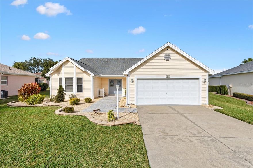 Spacious 3/2 Rivera model home in the Village of Terra Del Sol, just minutes to Lake Sumter Landing and Spanish Spring Town Centers. BOND PAID! Roof October, 2016, HVAC 2014, Hot Water Heater 2023 and new Washer. This beautifully updated and renovated home welcomes you with freshly enhanced landscaping and an elegant double stained-glass front door that sets the tone for what’s inside. Step inside to discover luxury vinyl plank floors that flow seamlessly throughout, complemented by ceiling fans with light kits for optimal ambiance. A solar tube in the living room fills the space with natural light, while the electric fireplace adds warmth and ambiance.
The newly completely renovated kitchen is both stylish and functional, showcasing granite countertops, new stainless steel appliances, a composite granite farmhouse sink, an island with breakfast bar, and under and over cabinet lighting enhancing the modern aesthetic. The adjacent dining area features a custom built-in storage unit with beverage refrigerator, ideal for hosting.
French doors with inset blinds lead to a screened lanai, perfect for enjoying the serene views of the golf course from your outdoor paver patio.
The spacious primary suite features a large walk-in closet and an ensuite bath with dual vanities, an updated walk-in shower, and two linen closets. Two guest bedrooms provide flexibility—one with a bay window and adjoining bath with shower.
Additional highlights include being freshly painted, a coat closet near the front entry, laundry located in the garage, and modern conveniences such as a Ring doorbell and exterior security cameras. This home offers comfort, style, and thoughtful upgrades throughout—perfect for relaxed living and entertaining. Terra Del Sol Bar and Grill, Theater and Golf Course are less than 2 miles away. You’ll be located centrally for all the Villages has to provide. Watch our video and schedule your appointment to see this home today.