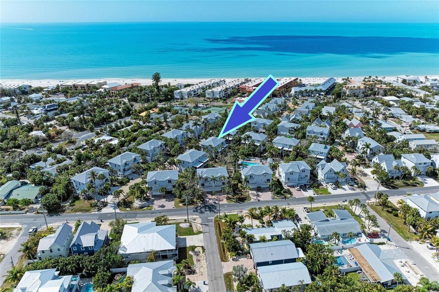 BEACHY KEEN… Just steps from the pristine shores of Anna Maria Island, this exceptional townhome is ideal as a weekend escape, a seasonal retreat from Old Man Winter, or a smart investment while retirement plans are still taking shape. Whether you’re tired of renting, dreaming of a coastal getaway, or looking to diversify with Florida real estate, this property checks all the boxes. Inside, you’ll find an updated kitchen designed to delight the family chef, featuring newer stainless-steel appliances, rich granite countertops, and classic shaker cabinetry. Stunning Brazilian rosewood flooring flows throughout the open, inviting floor plan, complemented by a dedicated dining area perfect for relaxed gatherings. A conveniently located first-floor powder room offers added convenience for guests. The expansive lanai off the living area is ideal for outdoor entertaining and provides easy access to the community pool. Upstairs, two spacious ensuite bedrooms each feature a private bath and their own balcony—perfect for morning coffee or unwinding at the end of the day. A two-car garage offers ample space for vehicles and other island essentials. Located less than 500 yards from the Gulf, your new home away from home invites daily beach walks, refreshing coastal breezes, and spectacular sunsets. Enjoy the island’s charming shops, restaurants, and community amenities including tennis, pickleball, and a baseball field. Come for the weekend, stay for the season, or plan for the future—either way, you’ll be glad you made this move.