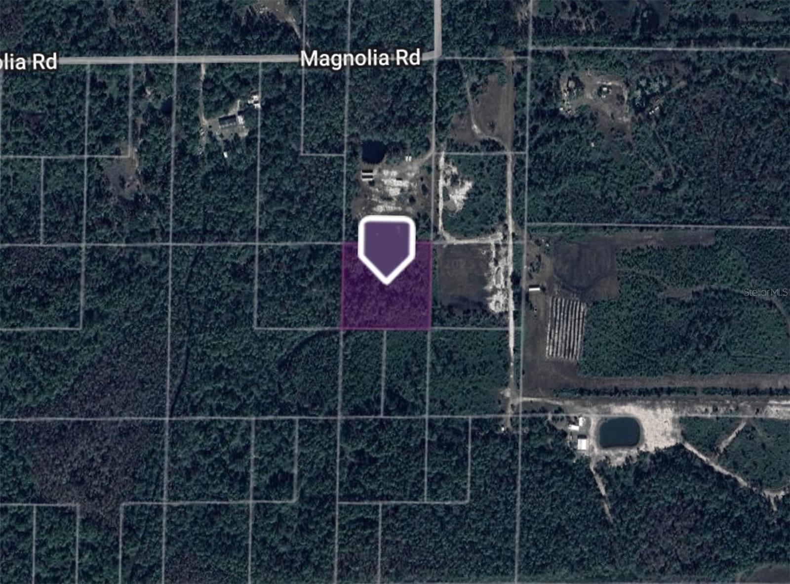 2.5-acre parcel located just west of I-95 in New Smyrna Beach, near the intersection of Magnolia Rd and Sharp Rd. The lot is currently landlocked, but sits only one parcel away from an access road. Buyers can establish access through easement rights, which are legal pathways that allow property owners to cross neighboring land. This is a common solution for parcels like this and ensures access can be secured when developing the property.
Zoned A-1 (Agricultural), offering flexibility for residential use, small-scale farming, or keeping animals. Located in Flood Zone X, which is considered low-risk and generally does not require flood insurance.
Parcel # 7231-00-00-0341, Coordinates: 28.97642334, -81.12548692. This property presents an affordable opportunity to own acreage in a growing area of Volusia County, with privacy, space, and long-term potential.