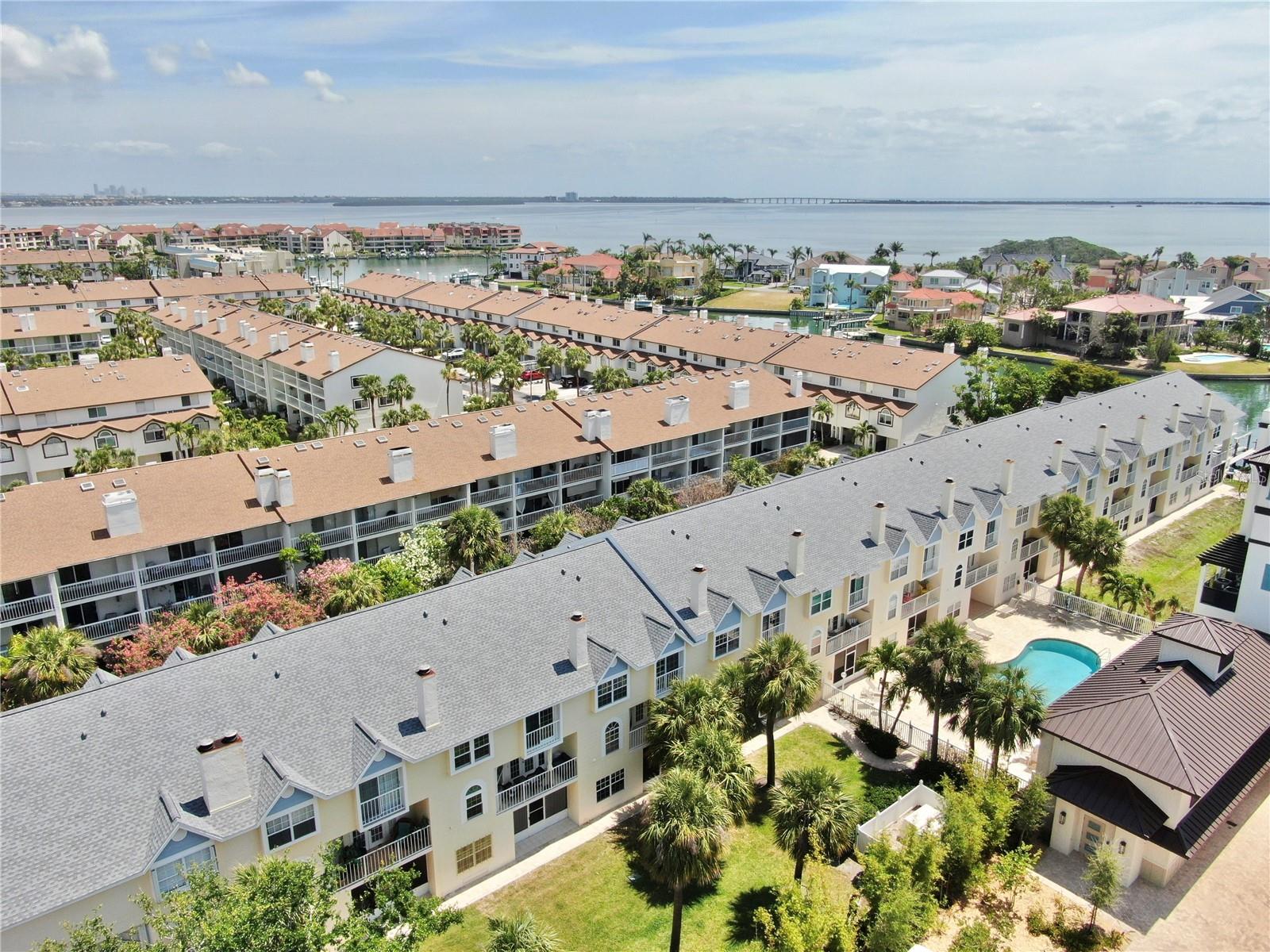 Reduced! BRING THE BOAT! If you’re looking for the ease of low-maintenance living combined with a deeded boat slip, this townhome is the ideal option. This stunning 3-bedroom, 2.5-bath residence is perfect as a primary home or a vacation getaway. It also offers a great investment opportunity with a six-month minimum rental period. With beautiful finishes and an abundance of natural light, the private balcony is a highlight.
The townhome features three impressive floors with a unique spiral staircase, a cozy wood-burning fireplace, soaring ceilings, and a combination of laminate and tile flooring. For those who prefer to skip stairs, an elevator makes accessing all levels easy. The oversized two-car garage provides ample storage solutions. The deeded boat slip includes a 12,000-pound lift, allowing for effortless access to the water. You can set off on your boat and explore the Intracoastal Waterway with direct access to the Gulf, perfect for reaching waterfront dining and fishing spots at your leisure. The furnishings are negotiable in this welcoming, golf cart-friendly community.
Living in Tierra Verde means you can fully engage in the coastal lifestyle while being mere minutes from some of the area’s best attractions. Enjoy a dog-friendly beach, quick access to Fort DeSoto, fantastic birdwatching, walking trails, and a variety of restaurants.
