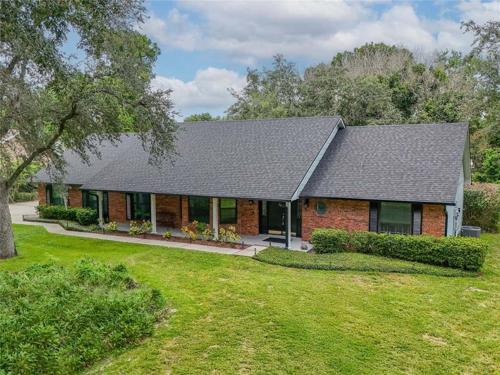 Photo of 7141 Wooded Village Lane, Orlando, FL 32835 (MLS # O6436400)