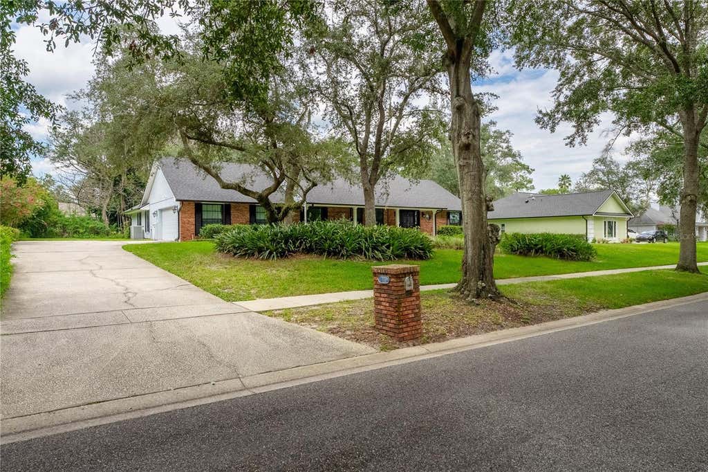 Photo of 7141 Wooded Village Lane, Orlando, FL 32835 (MLS # O6436400)
