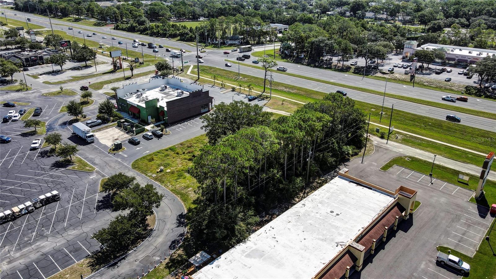 COMMERCIAL WAY COMMONS - Land
