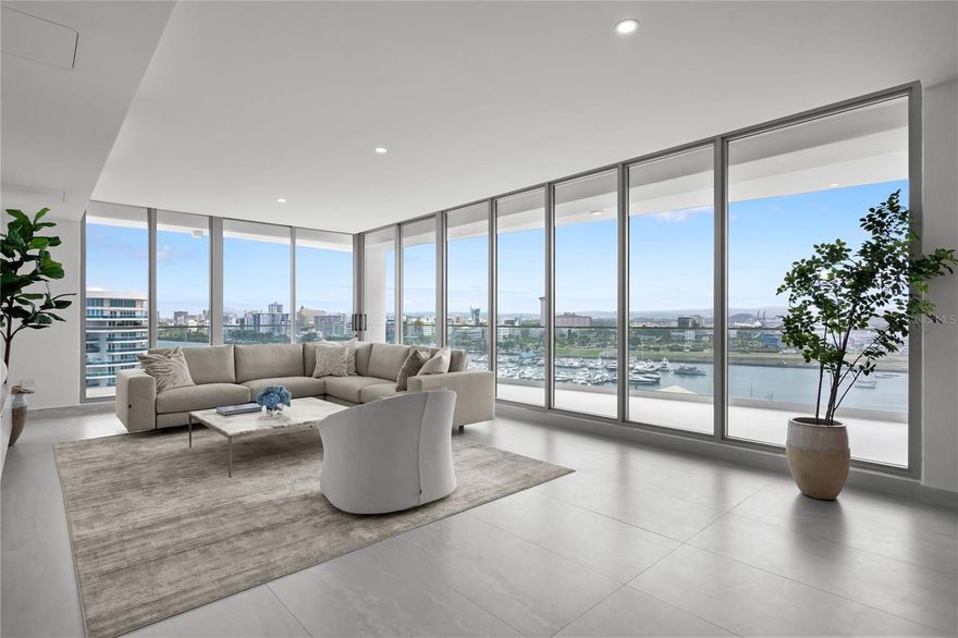 Introducing a singular opportunity to own a distinguished Penthouse residence in Le Parc, an exclusive new address in San Juan, Puerto Rico. Completed in 2025 and never before lived in, this exquisite home redefines contemporary island living—where refined design, comfort, and sophistication converge in one extraordinary setting. This turnkey, fully furnished penthouse is ready to be yours.
Poised above the San Juan Marina, this expansive 4,100-square-foot residence features four bedrooms and four and a half bathrooms, each thoughtfully designed to blend classic elegance with modern luxury and tastefully curated European furniture. The interior spans 3,250 square feet, showcasing 9-foot ceilings, custom-crafted cabinetry, and floor-to-ceiling windows that frame sweeping views of the Atlantic Ocean and city skyline. 
The open concept living and dining areas strike a seamless balance between grandeur and intimacy, creating an ideal environment for both quiet evenings and elegant entertaining. The gourmet kitchen is a chef’s dream, appointed with top-tier appliances, richly detailed cabinetry, and a generously sized quartz island, all anchored by timeless materials and exceptional craftsmanship. 
Each of the four-bedrooms have been designed as a private retreat, featuring en-suite bathrooms, custom closets, and serene finishes. The primary suite is a haven of comfort, complete with a spa-inspired bathroom offering dual vanities, sleek chrome fittings, and a glass-enclosed rain shower with tranquil views over the marina. A wraparound terrace spanning 850 square feet invites effortless outdoor living—from sunrise coffee to sunset gatherings. Integrated smart home system optionality, full shades, and temperature-controlled wine storage enhance everyday living with intuitive convenience. 
Le Parc is an intimate, 34-residence community, ensuring the utmost privacy and unrivaled amenities. Residents enjoy access to an opulent 4,000-square-foot rooftop oasis featuring wine lockers, bar, and multiple lounging terraces poised for sunset views and ocean vistas. The amenity offering continues with dual swimming pools, outdoor BBQ and kitchen, lounge areas, pickle ball court, dog run, and children’s play area. A state-of-the-art fitness center includes steam and sauna rooms, a cold plunge spa, and massage room.  24/7 security, 4 dedicated parking spaces with EV charging connection and climate-controlled storage provide everyday ease and peace of mind. This is more than a residence—it is a lifestyle of unparalleled refinement. In the heart of Puerto Rico’s most coveted coastal enclave, moments from the Isla Grande Airport, Condado, Old San Juan, and Escambron Beach, this one-of-a-kind Penthouse at Le Parc awaits its discerning new owner.