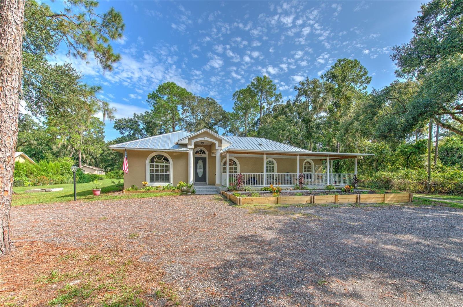 Welcome to your dream retreat on a sprawling, tree-lined lot! This beautifully updated home offers the perfect blend of modern comfort and natural serenity. Inside, enjoy stylish finishes, open concept living, and abundant natural light throughout. The expansive yard is ideal for peaceful mornings beneath mature trees or lively evenings around the fire-pit with friends and family. A standout feature is the versatile workshop, complete with a single bay door and divided into three sections—including a fully enclosed office. It’s wired for electricity and includes an RV hookup, making it perfect for hobbies, storage, or remote work. Backing to undeveloped pasture with a protected nature preserve beyond, the property offers uninterrupted views, privacy, and a peaceful connection to nature. With charm, space, and a rare natural backdrop, this property is more than a home—it’s a lifestyle. Conveniently located near the interstate, this retreat offers easy access to nearby amenities while maintaining a quiet, secluded feel.