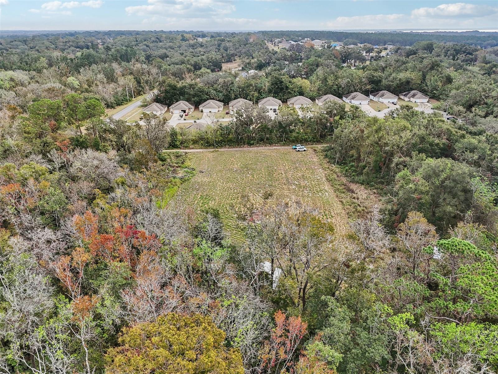 Build the home you want. Want other buildings for your business? It can happen here. Where can you find 2 acres tucked away so close to downtown Leesburg and access to US 441 and all the shopping, restaurants, businesses, Venetian Gardens, multiple Harris Chain of Lakes, and no time limit to start your building? This one! Only two homes on this road and no thru traffic of any kind. You can see this property without a showing. Look for the signs. Call me for a private showing or FaceTime if not local.
