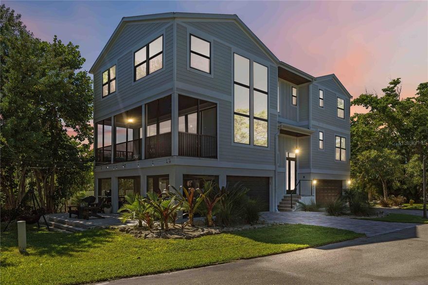 Welcome to Laguna Yacht Village on beautiful Longboat Key — a boutique waterfront gated community which includes bay access and is located across the street from the beach, offering refined coastal living at its best. This Key West–inspired, three-story single residence with an oversized 3-car garage features four bedrooms, three full baths, and over 2,886 square feet of beautifully designed living space.
Perfectly positioned to embrace the island lifestyle, this home includes a deeded deep-water dock (Slip #6) located in a protected lagoon just minutes from the Intracoastal Waterway and Gulf of Mexico — with no fixed bridges, making it a boater’s dream. Step inside and experience a harmonious blend of coastal elegance and comfort. Expansive living areas feature soaring ceilings, an abundance of natural light, and sophisticated finishes throughout.
The culinary-inspired kitchen, designed in timeless style, boasts custom cabinetry, quartz countertops, and an oversized central island — the ideal space for hosting and entertaining. The primary suite, complete with a study, serves as a serene retreat with dual vanities, a hydro-massage soaking tub, and a walk-in glass-enclosed shower for the ultimate spa-like experience.
Multiple balconies, including an elevated screened patio off the main level, provide refreshing sea breezes and captivating water views of the Gulf. A ground-floor patio further extends the outdoor living experience. The oversized garage provides ample storage for beach gear and boating essentials.
The gated community features a resort-style pool offering a true lock-and-leave lifestyle. Residents will appreciate convenient proximity to Longboat Key’s pristine beach, award-winning island restaurants, boutique shopping, and parks — all while being a short drive from the cultural heart of downtown Sarasota and St. Armands Circle.