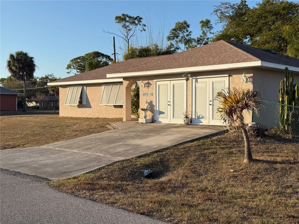 Photo of 18248 Regan Avenue, Port Charlotte, FL 33948 (MLS # TB8477095)