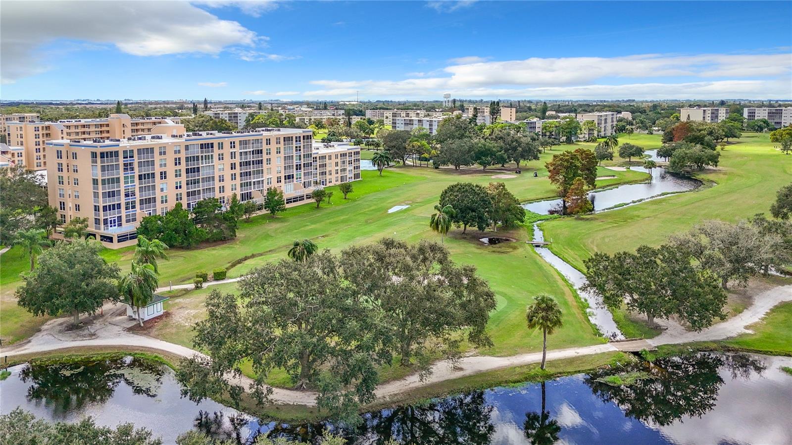 Nothing beats life at the top! This exclusive sixth-floor condo overlooks the golf course and lagoon. A covered private parking space is included on the ground floor near the elevator. An assigned storage unit conveniently located on the sixth floor is also included. Life is a joy at Pinebrook, with great neighbors and abundant social activities. The lifestyle is enhanced by a fitness center, outdoor screened-in barbecue area, library, billiards room, and tennis court. Fairways offers many social opportunities hosted at the clubhouse, such as potlucks, poker nights, morning aerobics in the pool, holiday parties, and much more. The building has been recently renovated with a new roof and all-new paint. The elevator & staircase have been updated & all assessments have been paid. It is located minutes from many choices for shopping and dining, with Island Life only 6 miles away on Anna Maria Island.