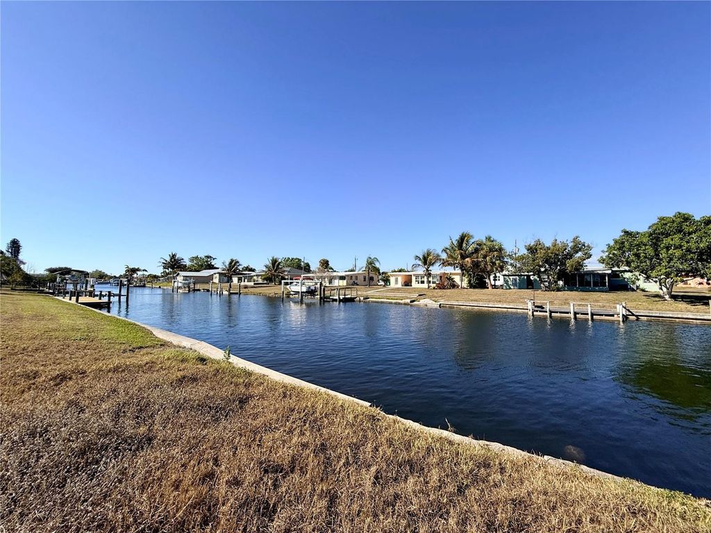 Photo of 851 Conreid Drive NE, Port Charlotte, FL 33952 (MLS # C7522360)