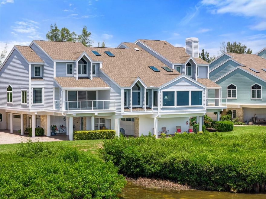 Experience the ultimate in luxury living with this spectacular bayfront residence on Tidy Island, a true gem in the heart of Sarasota Bay. Transformed through an extensive renovation, this home stands out as a unique masterpiece that seamlessly blends elegance, comfort, and modern sophistication. Spanning three generous bedrooms, this home ensures ample space for family and guests. The versatile loft area serves as a perfect home office, media room, or additional guest suite, tailored to meet your specific needs. The formal living and dining rooms are designed with sophistication in mind, featuring dramatic vaulted ceilings that enhance the sense of grandeur. Multiple skylights and expansive wall-to-wall impact windows flood the space with natural light, creating a bright and airy ambiance that is both inviting and energizing. The chef’s kitchen is a culinary enthusiast’s dream, equipped with top-of-the-line appliances including a Viking gas range with a custom hood, a Sub-Zero refrigerator, dual sinks, and a separate prep sink. This gourmet kitchen is not only functional but also aesthetically pleasing, with custom cabinetry and high-end finishes that make cooking a pleasure. Custom details abound throughout the home, from the exquisite stair railings to the built-in shelving and storage solutions that enhance both style and practicality. The residence has been updated with newer A/C units to ensure year-round comfort, and is presented in move-in-ready condition, allowing you to settle in without delay. Step outside to enjoy the outdoor living spaces, including a covered open patio perfect for al fresco dining or relaxing while taking in the views while visiting with company. The property also features multiple storage areas, a spacious two-car garage, and covered guest parking, catering to all your practical needs. Situated in a prestigious, gated community with 24/7 guard-controlled access, this home offers a secure and tranquil environment. Residents have access to a wealth of amenities, including well-maintained walking trails, kayak launching areas for waterfront adventures, tennis courts, swimming pools, a wellness area, and inviting gathering spaces for socializing and community events. Conveniently located just minutes from pristine Gulf beaches, top educational institutions like St. Stephens, IMG Academy, and Bradenton Christian School, as well as Sarasota-Bradenton International Airport, this property provides the perfect balance of serene seclusion and easy access to local conveniences. Embrace a lifestyle of unparalleled luxury and make this exquisite bayfront home your own.