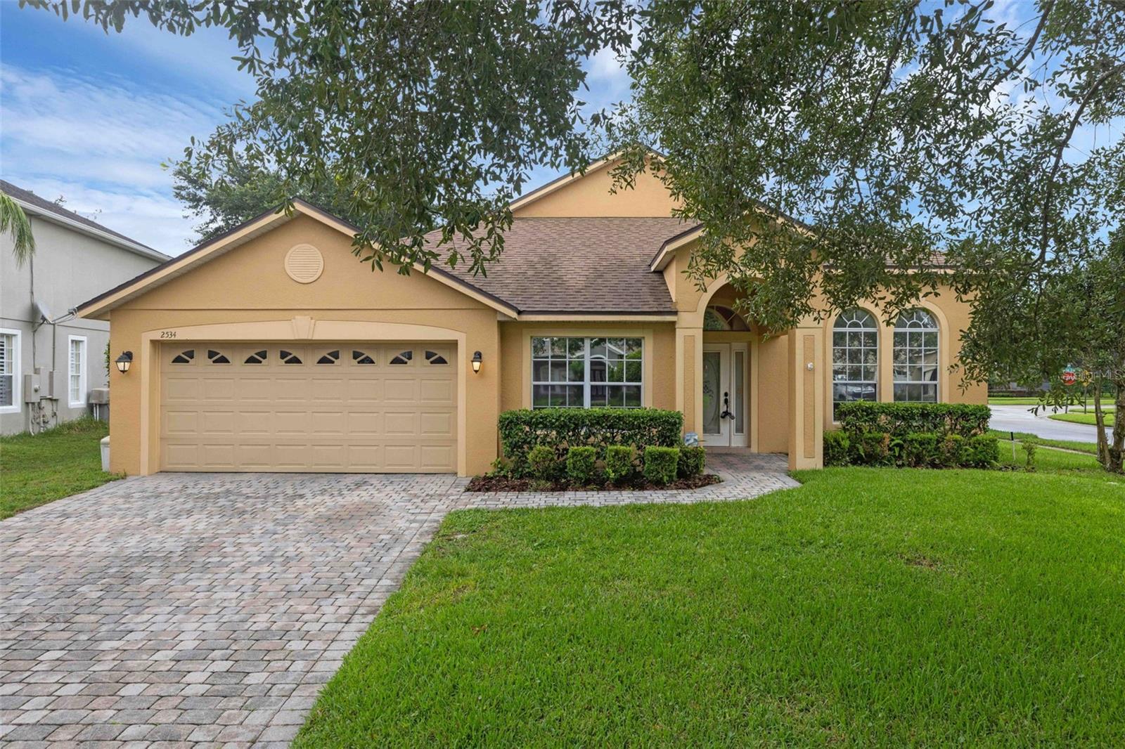 One or more photo(s) has been virtually staged. Welcome to this beautifully maintained 4-bedroom, 2-bathroom home in the sought-after Live Oak Reserve community in Oviedo! From the moment you step inside, you'll notice the elegant hardwood floors and a spacious bonus room with French doors—perfect for a home office, playroom, or guest space. The thoughtfully designed layout features a massive living/dining room combo and a large family room that flows into the open-concept kitchen, complete with granite countertops, a center island, stainless steel appliances, and plenty of storage. Sliding glass doors lead out to your private patio and lush backyard, surrounded by mature landscaping—ideal for relaxing or entertaining. The split-bedroom floor plan offers privacy and space, with a spacious primary suite featuring a huge walk-in closet, dual vanities, a garden tub, and a glass-enclosed shower. Down the hall, you’ll find three additional bedrooms, all with generous closets, and a second full bathroom with dual sinks and a tub/shower combo. A large laundry room adds extra convenience. Living in Live Oak Reserve means enjoying resort-style amenities including a community pool with waterslide, fitness center, basketball and tennis courts, soccer and softball fields, trails, splash pad, volleyball court, and two playgrounds. All of this is located near top-rated Seminole County schools, UCF, Seminole State College, Oviedo on the Park, and a wide variety of shopping and dining options. Don’t miss your chance to live in one of Oviedo’s premier neighborhoods!