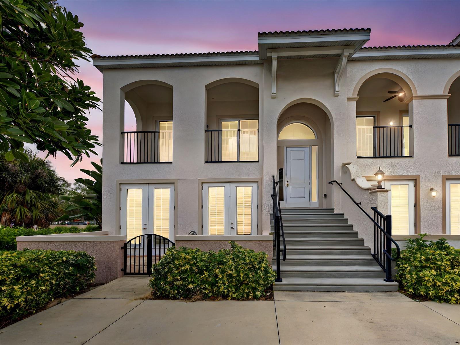 One or more photo(s) has been virtually staged. A Must See! On the Island of Venice, a beautiful END UNIT with multiple outdoor spaces, 2 car garage and even your own elevator. This end unit has additional windows allowing natural light to enter and fill the space. The tall ceilings and 8' raised panel interior doors add to the appeal of this home. This unit is conveniently located near shopping, dining, parks, beaches and all that Venice has to enjoy. All appliances and AC have been recently replaced so no issues there. There is additional storage located below the staircase. Schedule your showing today!