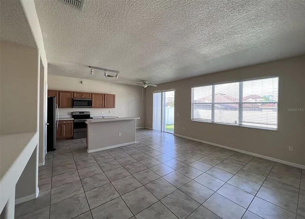 Photo of 247 Canna Drive, Davenport, FL 33897 (MLS # S5159782)