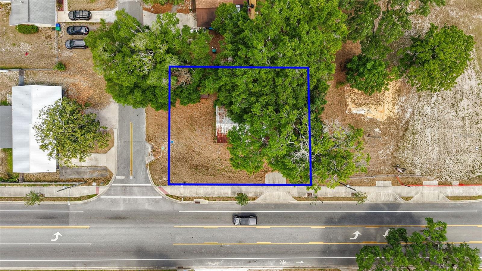 PRIME COMMERCIAL corner lot! Currently Zoned Medium Denisty Residential but easliy converted to Commerical Mixed Use ! This property is accessible to to The Villages, I-75 exits to all the central Florida locations of Orlando, Tampa and the Beaches! There is currently a block home in place with all active utlities in place to save on impact fees weather you completely remodel or rebuild a multiple unit residence, duplex or offices. There are many potential uses for this property for a great price!