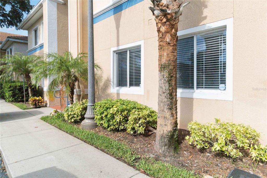 Photo of 521 Villa Del Sol Circle #102, Orlando, FL 32824 (MLS # O6389229)