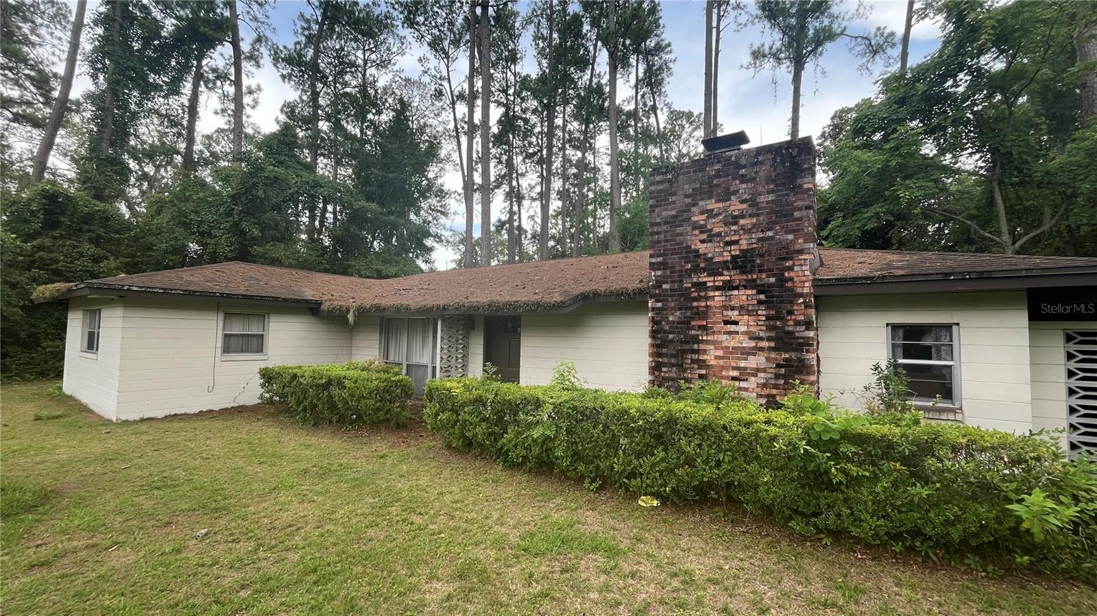 Located across the street from Magnolia Park and just minutes from Hunter's Crossing, Devil's Millhopper, and the shops and restaurants along 43rd Street, this 3-bedroom, 3-bathroom home offers over 2,500 square feet of space on a spacious half-acre lot. The right buyer will find real potential to transform it into something special. The layout features oversized living areas and bedrooms, and the lot provides plenty of room to expand or create your own private retreat. With a central location in Gainesville you’re close to parks, Publix, great schools, and just a short drive to UF and downtown.