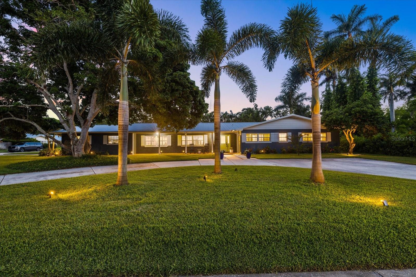 Stunning Fully Renovated Ranch-Style Oasis on Iconic Riverview Boulevard.
Welcome to your dream home in the heart of West Bradenton, nestled on the highly coveted Riverview Boulevard. This beautifully renovated five-bedroom, four-and-a-half-bath ranch-style residence sits on a picturesque half-acre lot with peekaboo views of the Manatee River and a setting that feels more like a private park than a suburban property.
From the moment you arrive, the circular driveway, side-load garage, and lush mature landscaping set the tone for the elegance and space that awaits. Step inside to over 3,000 square feet of thoughtfully updated living space featuring new flooring throughout, a brand-new chef’s kitchen, impact windows, updated doors, a newer roof, and stylishly renovated bathrooms. Every inch of this home has been upgraded so you can move in and immediately start enjoying.
The massive backyard is built to entertain, with a custom pool, sprawling green space perfect for kids, pets, or weekend parties, and ample room to park your RV or boat. The mother-in-law studio suite - 5th Bedroom with a private entrance, full bath, and closet offers the ideal retreat for guests, extended family, or even an income opportunity.
Located just down the street from the public boat ramp, and in close proximity to top-rated public and private schools, Anna Maria Island’s world-class beaches, downtown Bradenton, and major commuter routes including SR64, 301 and 41, this home delivers both luxury and lifestyle.
Whether you’re soaking up the Florida sun by the pool, hosting family in the oversized lanai, or launching your boat for a day on the water, this home checks every box—and then some.