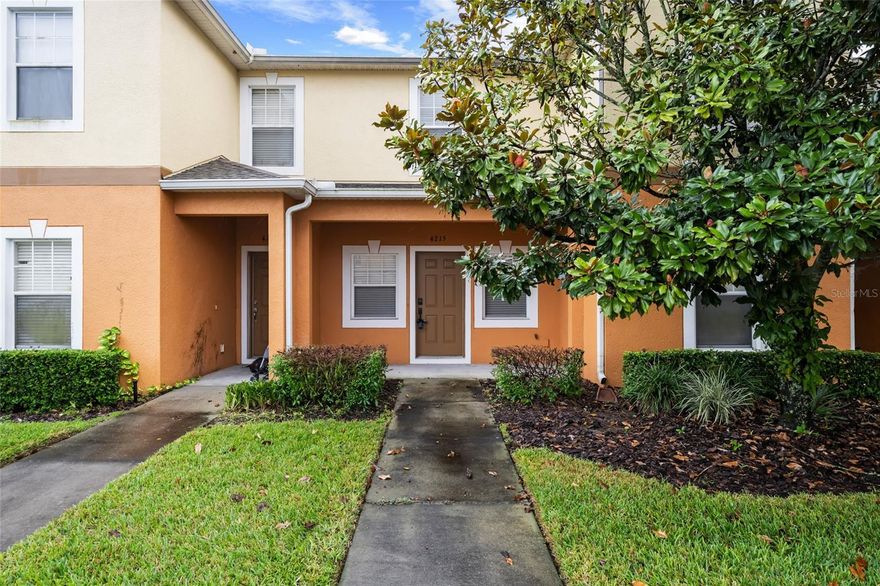 Look no further for the perfect move-in ready 2 bedroom, 2.5 bathroom townhome nestled within the gated community of Autumnwood Grove. The community is conveniently located to everything that Lakeland has to offer and provides easy access to all major highways! This interior unit offers assigned parking out front and guest parking nearby. Once inside, you are greeted with light and bright paint, tons of natural lighting, and neutral carpeted flooring. A spacious combination living and dining room offers upgraded rattan light fixtures, built-in gas fireplace with storage, and arched entries into the kitchen. The kitchen is complete with closet pantry, breakfast bar, white cabinetry, upgraded appliances, tile backsplash, solid surface countertops, and laundry closet. A half bathroom is located here on the first floor for convenience and additional closet space provides ample room for storage. Upstairs you will find two bedrooms and bathrooms. The master suite is located off the back of the home and offers double closets, upgraded ceiling fan, views of the back of the property, and en-suite bathroom, complete with single-sink vanity and shower/tub combo. The second bedroom offers an upgraded ceiling fan, small walk-in closet, and window overlooking the front of the home. The secondary bathroom is complete with another single-sink vanity and shower/tub combo. Sliding glass doors in the kitchen open to a covered and screened patio overlooking a small yard and lush, mature landscaping. An additional storage closet is located here on the patio, perfect for storing all of your holiday decor! Don't miss out on your chance to call this great home your own!
