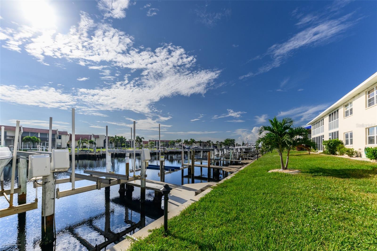 SEASONAL RENTAL- AVAILABLE NOW. Waterfront Seasonal Condo in Punta Gorda Isles
Enjoy the best of waterfront living in this beautifully furnished 2-bedroom, 2-bathroom first-floor condo in highly desirable Punta Gorda Isles—just minutes to open water.
This residence features an open, split-bedroom floor plan with porcelain tile flooring throughout. The spacious, updated kitchen offers abundant cabinetry, a breakfast bar, and a cozy dining area, while the adjoining great room showcases stunning canal views and direct access to a private screened lanai.
The primary suite boasts tranquil water views, a walk-in closet, and a private bath. The guest bedroom and full bath are located on the opposite side of the condo, ensuring comfort and privacy for visitors.
For boating enthusiasts, this property includes a concrete dock with a 10,000 lb. boat lift, providing quick access to Charlotte Harbor and the Gulf of Mexico. Additional amenities include a large community pool and an assigned covered parking space.
Ideally situated, this condo is just moments from Fishermen’s Village, downtown Punta Gorda, dining, shopping, parks, biking and walking trails, entertainment, and medical facilities.
This seasonal rental offers the perfect blend of convenience, style, and waterfront lifestyle.