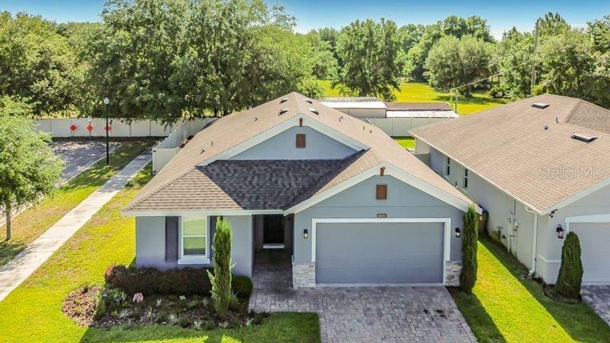 Welcome to this beautifully maintained newer-construction home! Built in 2019, this spacious property perfectly blends modern design, comfortable living, and the tranquility of a country-style setting while remaining conveniently close to everyday amenities. From the moment you arrive, you’ll appreciate the peaceful surroundings, generous lot size, and evident pride of ownership throughout.

Inside, the home features an inviting open-concept layout filled with natural light, creating the ideal space for both everyday living and entertaining. The thoughtfully designed floor plan offers spacious living areas, comfortable bedrooms, and a seamless flow between the kitchen, dining, and family spaces. Contemporary finishes and newer construction provide peace of mind and allow buyers to enjoy modern living without the concerns often associated with older homes.

This home is loaded with upgrades, including high ceilings in the primary bedroom, 42-inch kitchen cabinets with quartz countertops and a stylish backsplash, tile flooring throughout the common areas and primary bedroom, a custom-designed primary closet, upgraded closet doors throughout, and beautifully tiled showers in both bathrooms. Additional features include a fenced backyard, a newer storage shed that conveys with the property, and many more thoughtful enhancements that make this home truly move-in ready.