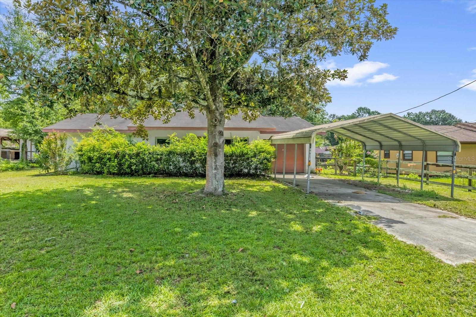 Discover this AFFORDABLE and WELL-MAINTAINED 3 bedroom 2 bath concrete block home comes with many amenities.
1 Car Garage with Washer and Dryer hook-up carport, large kitchen open to dining room and living space. The kitchen features lots of countertop space and cabinets, dishwasher, range, and refrigerator. Tile flooring ini main areas. Ceiling fans in each room. NEW HVAC 2025. Well was serviced 2023. Newer Water heater installed in 2021.interior and exterior of home. Large backyard with Shed and screened porch. Close and convenient to restaurants, shopping centers, and the World Equestrian Center. Don't miss out on this one!