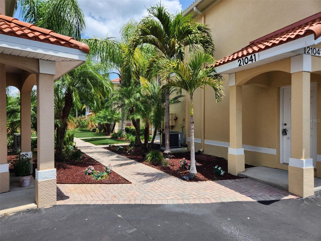 Photo of 21041 Sunpoint Way #202, Lutz, FL 33558 (MLS # W7875159)