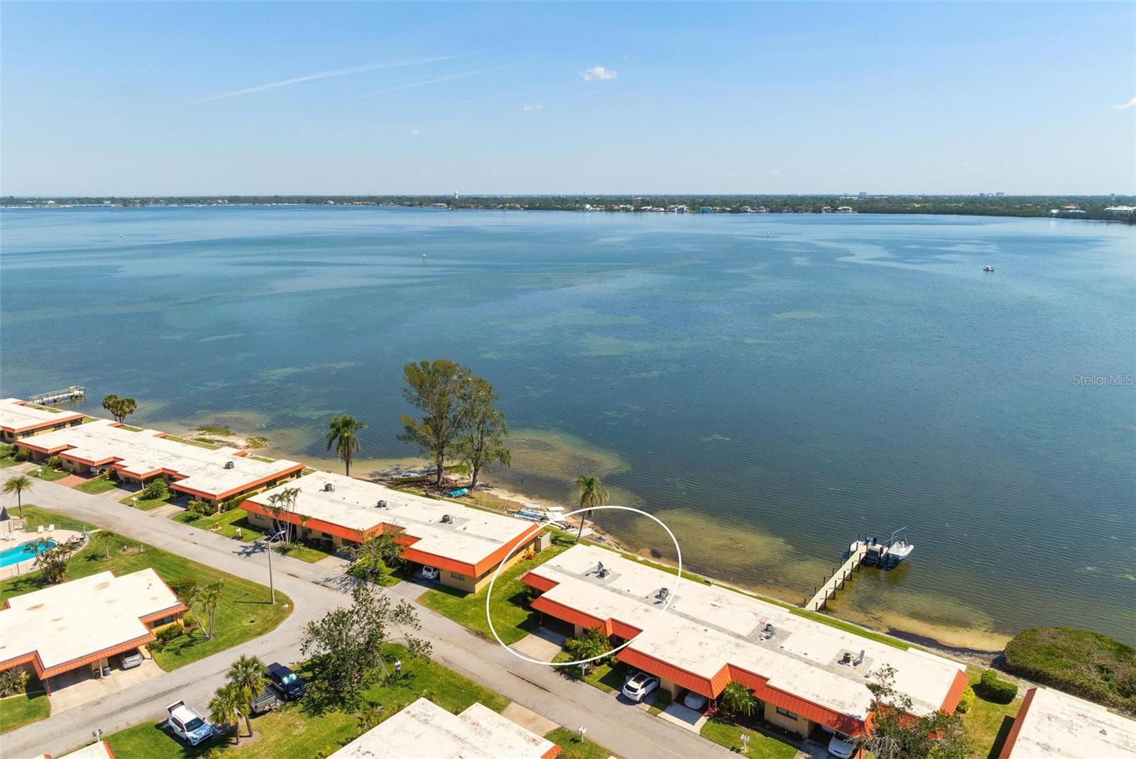 Discover the ultimate combination of location, charm, and convenience in this stunning 2-bedroom, 2-bathroom end-unit condo overlooking the picturesque Palma Sola Bay. Just a few miles from the world-renowned beaches of Anna Maria Island, this home is ideal as a full-time residence or a tranquil winter getaway. Being an end unit, the condo boasts additional windows, filling the space with natural light and creating a warm, inviting atmosphere. The bright and airy kitchen, complete with tiled floors, sets the stage for easy living, while the sliding door in the living room leads to a serene screened patio with panoramic bay views. Enjoy the beauty and durability of stylish laminate flooring in this home offering a realistic wood look and a touch of elegance. This villa comes fully furnished (with exceptions) and features a soothing coastal décor throughout, making it move-in ready. Located in the highly desirable, gated community of Palma Sola Harbor, you’ll enjoy access to incredible amenities, including two pools, a fitness center, tennis/pickleball courts, a putting green, billiards room, 2 dry saunas, clubhouse with various activities, libr.ry and workshop with tons of tools. The community is pet-friendly and welcomes large dogs, offering a park and gazebo to complete the perfect neighborhood experience. With its unbeatable location close to shopping, dining, and the pristine beaches of Anna Maria Island, this villa offers exceptional value and a rare opportunity to own a piece of paradise.
Don’t miss your chance—schedule your private showing today and make this beautiful home yours!