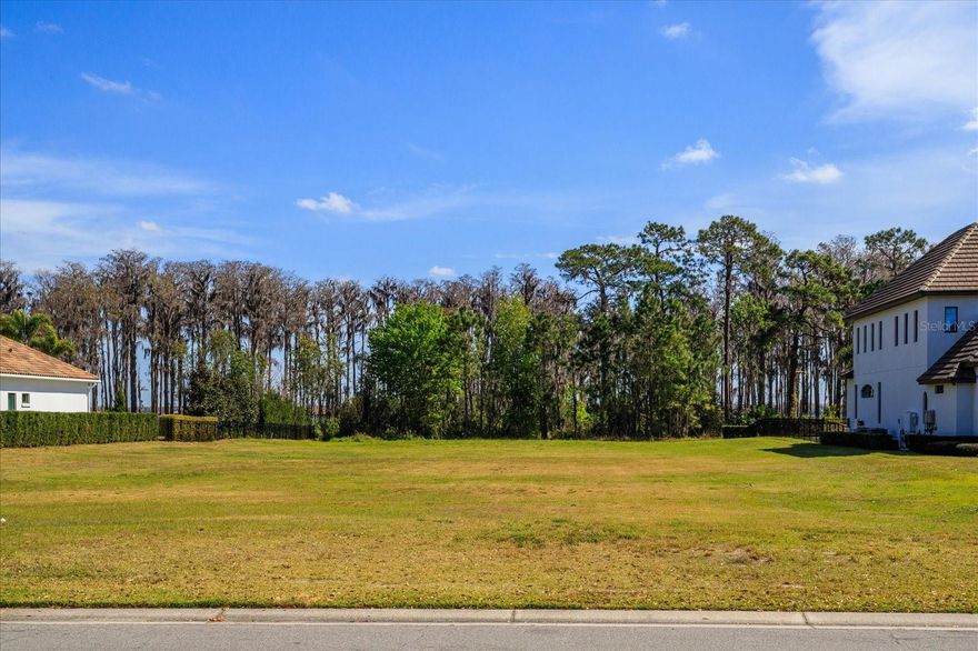 Keene's Pointe - gated/24-hour attended community in Windermere, Florida.  LAKEFRONT LOT IN THE VILLAGE OF GROSVENOR. Take advantage of this opportunity to build on one of the last remaining lots in this highly sought after community.  This 2.4 acre lakefront lot is located on Lake Tibet of the famed Butler Chain of Lakes.  Keene's Pointe is also home to The Golden Bear Club, a private membership club offering golf, tennis, fitness, swimming and dining. Near top-rated public and private schools, shopping, dining, expressways, and Disney!