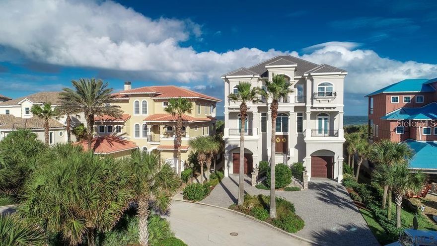 Pristine ocean front home in the desirable Ocean Hammock Community.   This stately home features a unique third floor master living area to maximize the beautiful full ocean views. Featuring a large master en-suite, office, half bath and a huge kitchen, dining area and spacious living room.   Second floor features are just as incredible with an amazing ocean views open flowing floor plan, second master en-suite, split bedroom with full baths, half bath, wet bar and a beautiful spa/pool entertainment area which maximizes the full ocean views.  Features of this home are endless; solid reclaimed wood floors through out home, elevator to 3rd, Control 4,solid wood cabinets, outside private shower, two half baths, 4 full baths, office, two fireplaces, two huge garages with ceilings that are 18' high, plumbed for additional bath on level one, brand new AC units, pool room under the level 2 pool that houses pool heater and equipment. This home was build to withstand nature with the solid concrete block construction, high end hurricane impact doors and windows and set back on a double dune with a private dune walk over.  These are just a few details this is a must see home!