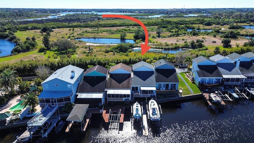 One or more photo(s) has been virtually staged. FINALLY!!!! This spacious 3 bedroom, 2.5 bath WATERFRONT home offers coveted Gulf access without the premium price tag! AND NO HOA!! You will not find a home on the water with these amenities for this price anywhere! Inside, soaring vaulted ceilings and three sets of sliding glass doors fill the open concept living area with natural light and water views. The kitchen is built for entertaining with a large bar top, solid wood cabinetry, stainless steel appliances, and granite countertops. Upstairs, the oversized primary suite features a private en suite bathroom with a large soaking tub, walk-in shower, double vanity and walk-in closet. On the third floor you will find 2 generously sized bedrooms with a large Jack-and-Jill style bathroom ensuring privacy from both sides. Outdoor living SHINES with a large Trex deck (new in 2024) covered by an aluminum awning (Also 2024) perfect for morning coffee or evening sunsets. Under the patio you find a turfed area perfect for your pets! Boating enthusiasts will love the large boat dock equipped with a 10,000 lb boat lift, a floating jetski/ john boat dock, and a NEGOTIABLE 20,000 lb lift. PUT YOUR TOYS IN AT THE END OF THE STREET!! BOAT RAMP 100 FT AWAY!! Additional highlights include a two- car garage with a 220V EV charging port, nearly 400 square feet of extra storage space under the home, NEW ROOF IN (OCT 2021), HOT WATER HEATER IN 2025, AND TWO NEW AC SYSTEMS IN (DEC 2023) 3 ton, and a 3.5 ton. Come live the dream today! ASSUMABLE FLOOD INSURANCE AT $1,604 FOR THE YEAR.