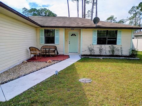 Photo of 218 Boulder Rock Drive, Palm Coast, FL 32137 (MLS # O6366619)