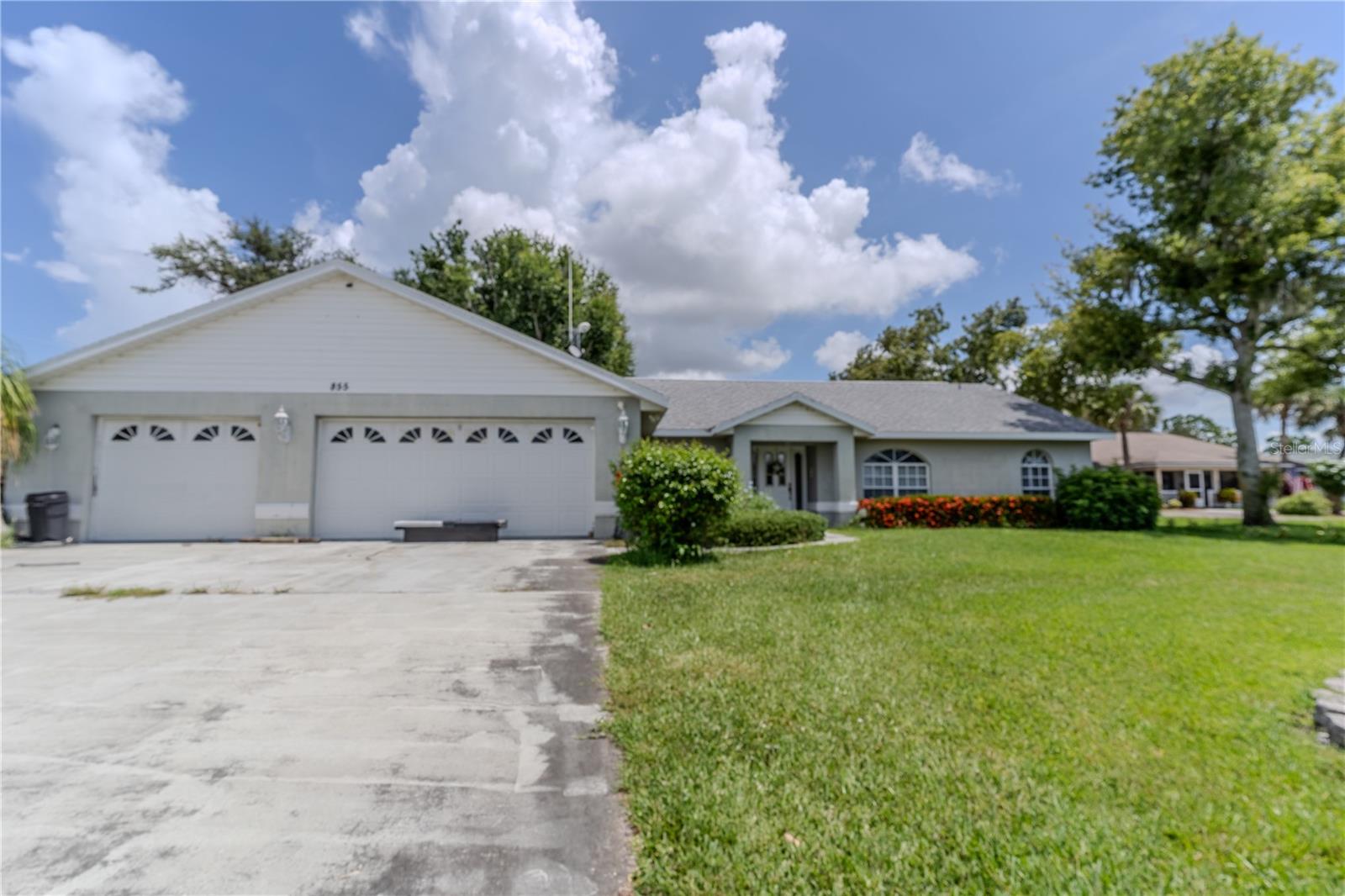 This charming 3 bedroom, 2-1/2 bathroom home, complete with a dedicated office, 2-car garage, and a special golf cart garage, is a true gem nestled on a prime lot overlooking Lake June, one of Highlands County’s most coveted lakes. Built in 1995 by its sole owner, this meticulously maintained residence boasts breathtaking lake views and direct deeded access, allowing you to embrace lakeside living without the constraints of an HOA. Featuring a desirable split-bedroom open concept floor plan, large bright windows fill the home with natural light, creating an inviting atmosphere throughout. Enjoy peace of mind with a newer roof and relax in the spacious screened-in back porch, surrounded by a lush yard filled with fruit and oak trees—truly a nature lover’s paradise! The property also includes two handy sheds and an expansive 2,400 sq. ft. workshop under air, ideal for hobbies, business ventures, or additional storage. Perfectly positioned near shopping, vibrant downtown attractions, and essential hospitals, this unique and well-cared-for property offers the perfect blend of privacy and accessibility. Don’t let this incredible opportunity slip away—make this lovely house your home today!