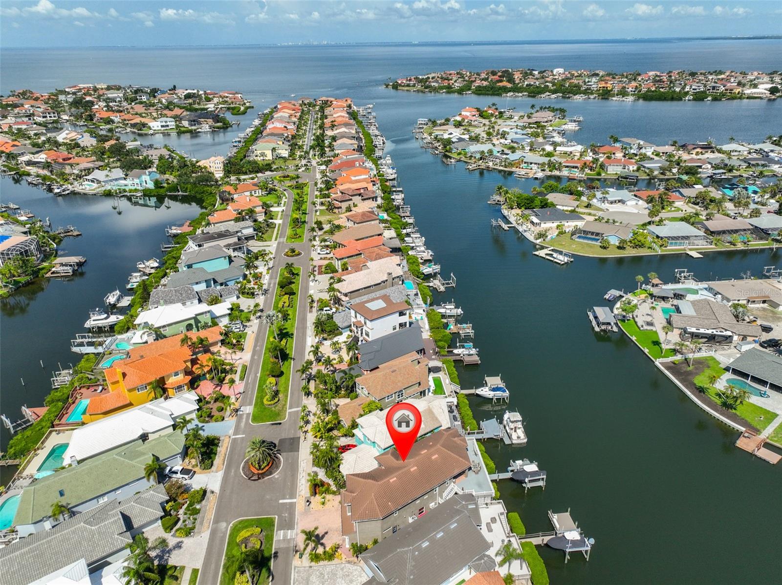 Indulge in the pinnacle of waterfront living in Symphony Isles. Sunset views paint the horizon as graceful boat traffic and festive parades drift by, all from your private deck within the Best canal in Apollo Beach. This exceptional residence blends refined luxury with thoughtful practicality, offering a fully finished basement and an expansive open-plan living area framed by breathtaking water vistas.
Upstairs, discover three elegant bedrooms and three spa-like baths, while downstairs presents a pristine conversion complete with a kitchenette, bonus room, an additional bedroom, and a full bath - ideal for guests, in-law quarters, or a private retreat. A double-door entry welcomes you to gleaming wood floors, a tray ceiling with wood molding, and recessed lighting throughout, complemented by upgraded fixtures and ceiling fans.
Culinary excellence awaits in the chef's kitchen, featuring maple cabinetry, 42" uppers, luscious granite countertops, a generous island and breakfast bar, and stainless steel appliances. The luxurious master suite includes a bay window with a custom bench, tray ceiling, an expansive walk-in closet, and a resort-inspired ensuite with dual vanities, a garden tub, and a separate shower.
Recent enhancements elevate peace of mind and comfort: newer concrete seawall, newer roof, newer AC, new water heater, new water softener, new impact windows, plantation shutters, and hurricane covers for both lanais guarding the sliders. A private elevator adds convenience and exclusivity.
Step outside to unrivaled outdoor living - two generous deck spaces (upstairs and downstairs) with stylish pavers, a PVC fenced yard, and direct access to a dock equipped with a 10,000 lb lift. Open waters are just moments away, inviting you to boat, fish, swim, or simply savor the sea breeze.
Residents of Symphony Isles enjoy a gated, 24-hour secured enclave with private roads, a private boat ramp, a private beach with gazebo and volleyball, a community pool, and playgrounds -an authentic resort lifestyle year-round.
Schedule your private showing today and experience the luxury, security, and serenity of this premier waterfront haven.
