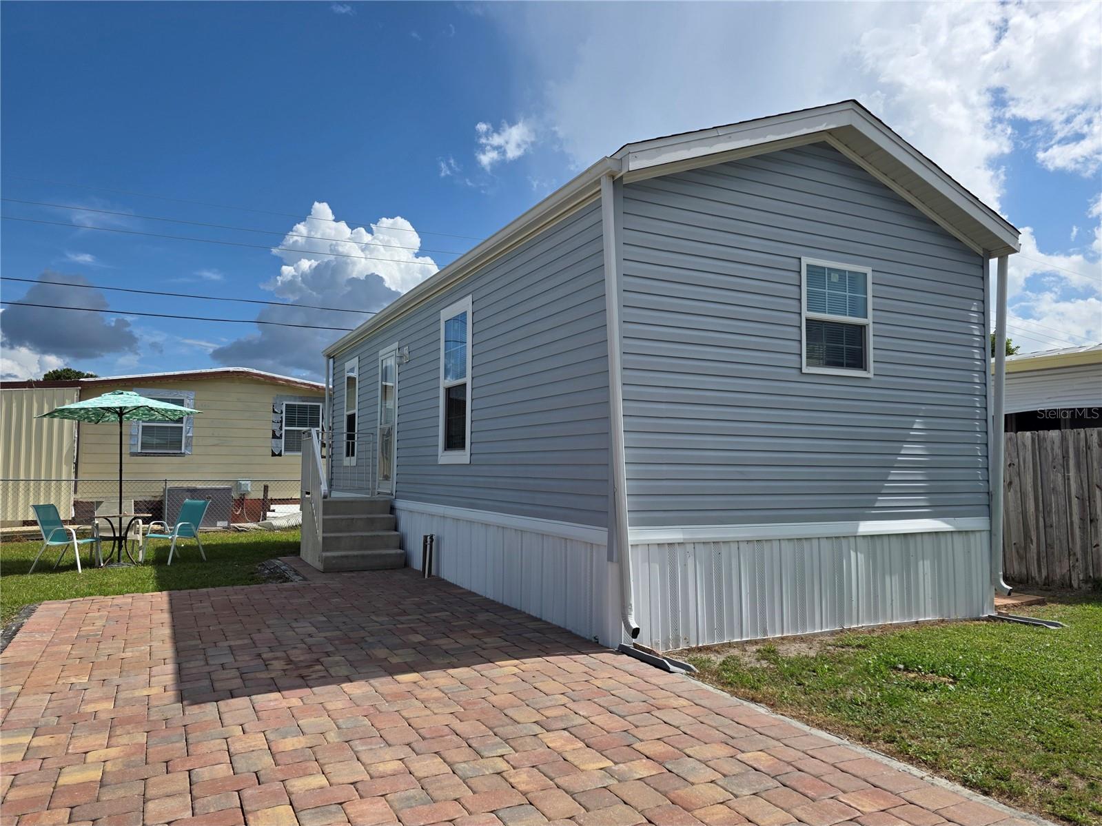 Step into your own slice of sunshine with this charming tiny home in Bradenton! Located in the 55+ Fair View Acres community, this 2020-built, 1 bed / 1 bath manufactured home is the perfect mix of cozy comfort and easy living. Best of all, you own the land—NO LOT RENT!
Enjoy a freshly painted interior in this easy-to-maintain interior. The central A/C system was installed in 2022 and has been serviced like clockwork every 6 months. This cute-as-a-button home is clean, efficient, and ready for you to move right in. Your cozy home includes a washer and dryer for convenience, plus there is a shed for added storage.
Tucked in a friendly 55+ community offering a pool, a clubhouse with scheduled activities, pickleball courts, and shuffleboard courts, your new Florida home is less than 10 miles from Bradenton Beach. You’re also close to all that makes Bradenton a perfect place to live—shops, dining, golf, and coastal charm at every turn.
This is low-maintenance, high-enjoyment Florida living at its best. Schedule a tour today and discover your new simple Florida lifestyle!