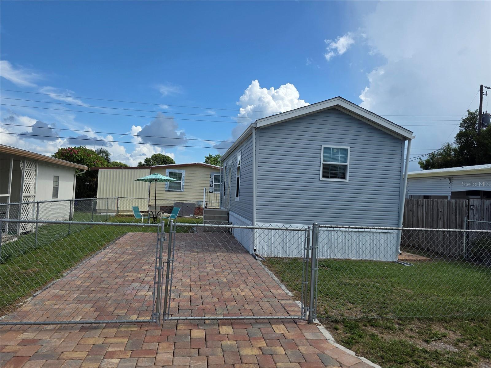 Welcome to easy Florida living in this charming Bradenton tiny home that includes a one-year Fidelity National Home Warranty covering appliances for added peace of mind. Built in 2020, this one bedroom, one bath manufactured home is tucked inside the 55+ Fair View Acres community and offers the perfect mix of comfort and convenience. Best of all, you own the land and don't pay lot rent.
The freshly painted interior feels bright and welcoming, while the central A/C system, installed in 2022 and serviced every six months, keeps the home efficient and reliable. A washer and dryer are included for your convenience, and a shed provides extra storage. Clean and move-in ready, this home is designed for easy maintenance and worry-free living.
Fair View Acres offers a friendly atmosphere with amenities such as a pool, clubhouse with scheduled activities, pickleball courts, and shuffleboard courts. Just under 10 miles from Bradenton Beach and close to shops, dining, golf, and everything that makes Bradenton special, this home puts you near it all.
This is low-maintenance, high-enjoyment living at its best. Schedule your showing today and start enjoying your new Florida lifestyle.