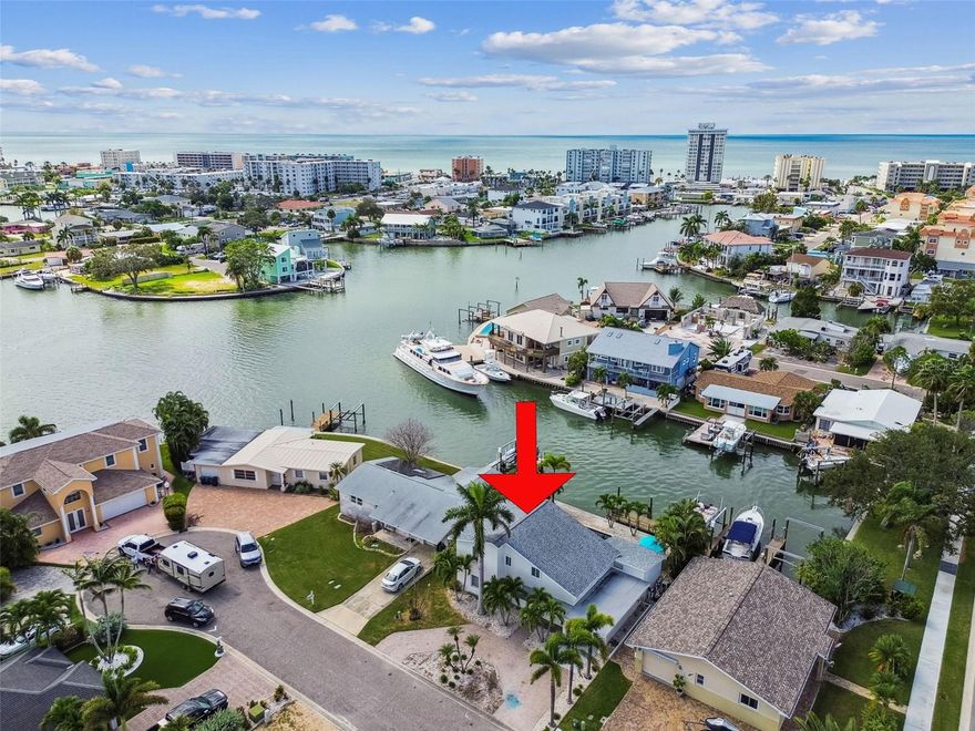 Don’t miss this rare opportunity to own a slice of paradise in one of Redington Shores’ most desirable waterfront neighborhoods. This boater’s dream home offers breathtaking water views and a saltwater pool perfectly positioned for stunning western sunsets, with plenty of space to entertain family and friends. The dock is thoughtfully designed with room for dock boxes, grills, a built-in filet table, and a dock light for late-night fishing adventures. It’s fully equipped with two 30-amp plugs and freshwater access for easy cleaning. Boating enthusiasts will appreciate the 15,000 lb boat lift, sailboat-depth wet slip (7–9 ft) for vessels up to 36 ft. With two drawbridges on your route south, you’ll reach open Gulf waters in just 20 minutes or head north to Clearwater Pass for another scenic option. Inside, this 4-bedroom, 2-bath home once offered a cozy beach cottage feel, with a stylish living and dining room combination that opens to views of the pool and dock. While the home incurred damage during Hurricane Helene, it has been determined “not substantially damaged”, the dock / lift, pool, AC unit (2024) are all in working order giving you peace of mind and a solid foundation for your personal touches. This is your chance to embrace the Florida lifestyle schedule a showing today!
