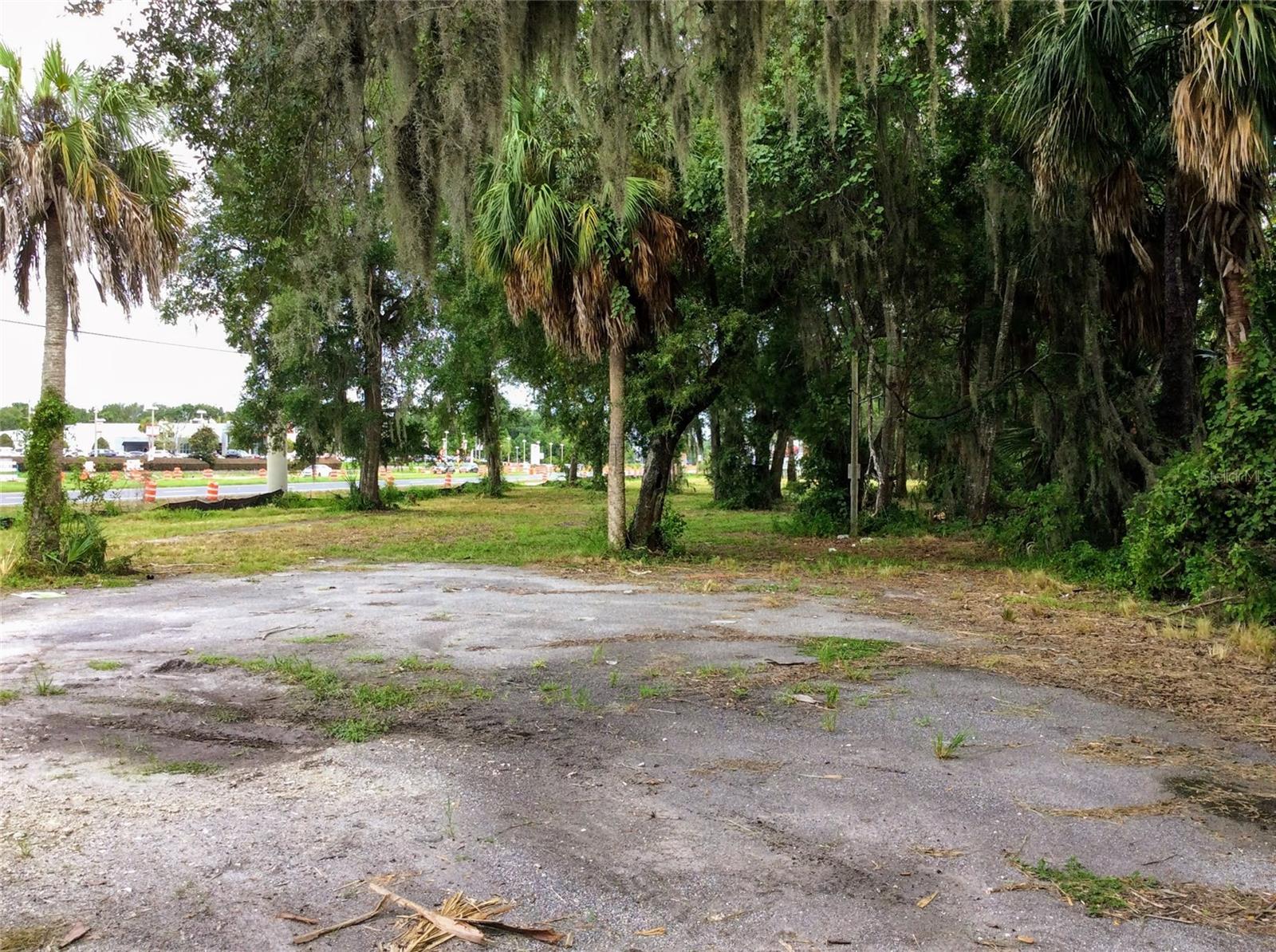 This 1.21-acre vacant lot, located in a General Commercial District, is available for land lease and boasts 441 feet of prime frontage along U.S. Highway 19. The property is well-equipped with essential utilities, including on-site county water, high-speed cable, an electric pole, and new drainage, with sewer access available in the area. With a high traffic count of 22,000 cars per day, visibility is enhanced by recent Highway 19 widening and newly added sidewalks. The lot has undergone extensive tree removal, leaving a significant portion cleared and ready for development. Strategically positioned with easy access to the Veterans Expressway and just half a mile from city limits, the property is situated across from auto dealerships, offering significant potential for future growth. The owner, a Florida licensed real estate broker, advises potential lessees to conduct their own zoning research to ensure compatibility with their intended use.