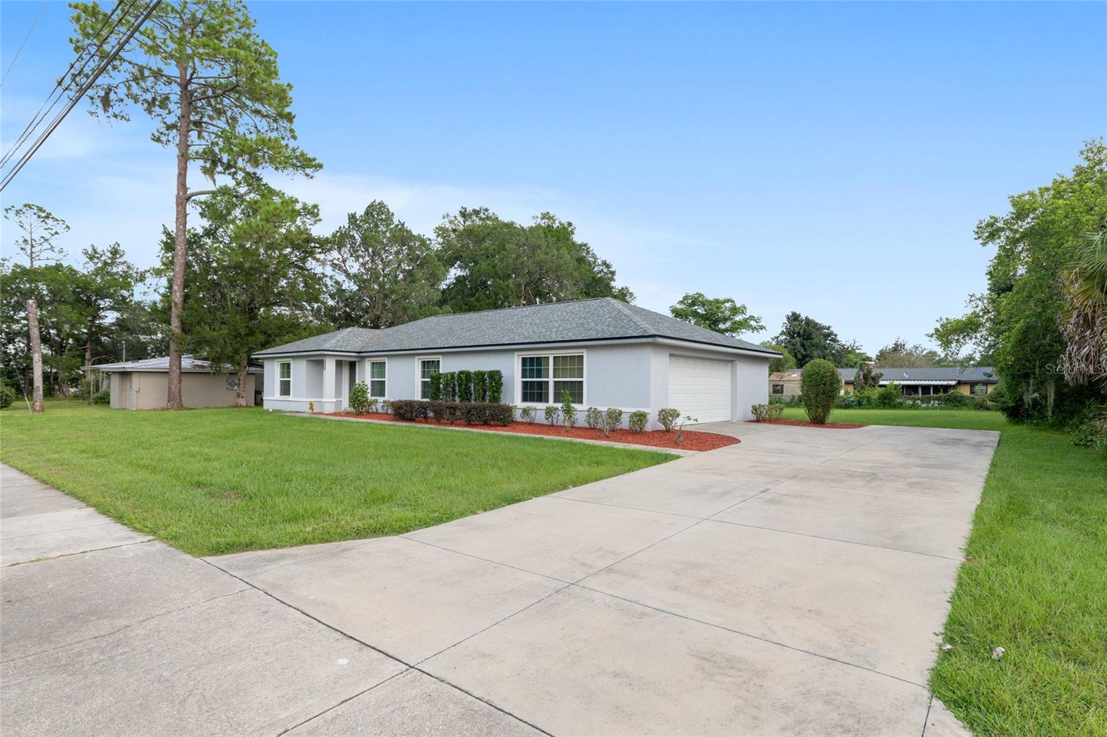 Beautiful 3 Bedroom, 2 Bathroom with 2 Car Garage for Lease! FULLY FURNISHED! Located near the heart of Downtown, Shopping, Golf and More! GREAT LOCATION! Conveniently located near grocery shopping! Publix is within walking distance! Enjoy this open floor plan, light and bright home complete with Luxury Vinyl flooring throughout. The spacious kitchen features new white cabinets, dishwasher, stainless steel appliances, large pantry and plenty of storage! In addition to the eating space in kitchen is a completely separate dining area that flows into the large living area, complete with plush seating, entertainment center and large SmartTV. The primary room features large windows overlooking the front yard, allowing ample light to flow, a spacious walk-in closet and ensuite primary bathroom. The second and third bedrooms are also great in size, featuring built-in closets with ample storage space, large windows and luxury vinyl floors. NO CARPET!! The second bathroom is just down the hall and features a shower/tub combo, large vanity and storage. The walk-in laundry room is just off the kitchen and features a washer and dryer as well as storage racks with a separate entry to garage. The 2 car garage is off to the side of the home and there is additional parking space available in the driveway. There is a separate door as well leading out to the backyard. This home is pet friendly and features a spacious front and backyard! Brand New Landscaping all around! This rental won't last long! Schedule your private tour today.