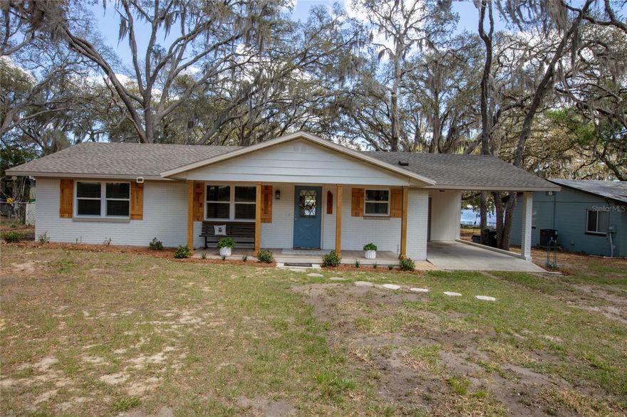 Lakeside Living at Its Finest...Discover the perfect blend of comfort, space, and natural beauty at this stunning property on White Sands Lake. This home offers the peace and privacy of country living while keeping you just minutes from local dining, shopping, and top-rated schools. Step inside to find bright open living space, and panoramic views of the lake. This upgraded home you will surely don't want to miss. New paint interior and exterior, bathrooms all new tile showers, vanities, toilets, flooring and lighting. All new kitchen cabinets, appliances, quartz countertop and designer backsplash. New butcher block island with enclosed microwave. New lighting throughout the house including closets. New tile flooring throughout to include porches. New interior doors and hardware. New French doors and picture windows. New drywall and knockdown ceilings. New electrical panel and 50amp RV hook-up, plumbing. New Pella windows Jan 2026. New wood columns and T&G pine ceiling on both porches. Renovation began April 2023. Roof 2022, hot water heater 2022, A/C 2021, current termite bond. Outside plenty of room to spread out, whether space for your RV with power, water, septic hook-up available, boat or garden. Partial fencing. Just a short drive to Gainesville, Palatka and Jacksonville. Ideal for full-time living or weekend getaway.